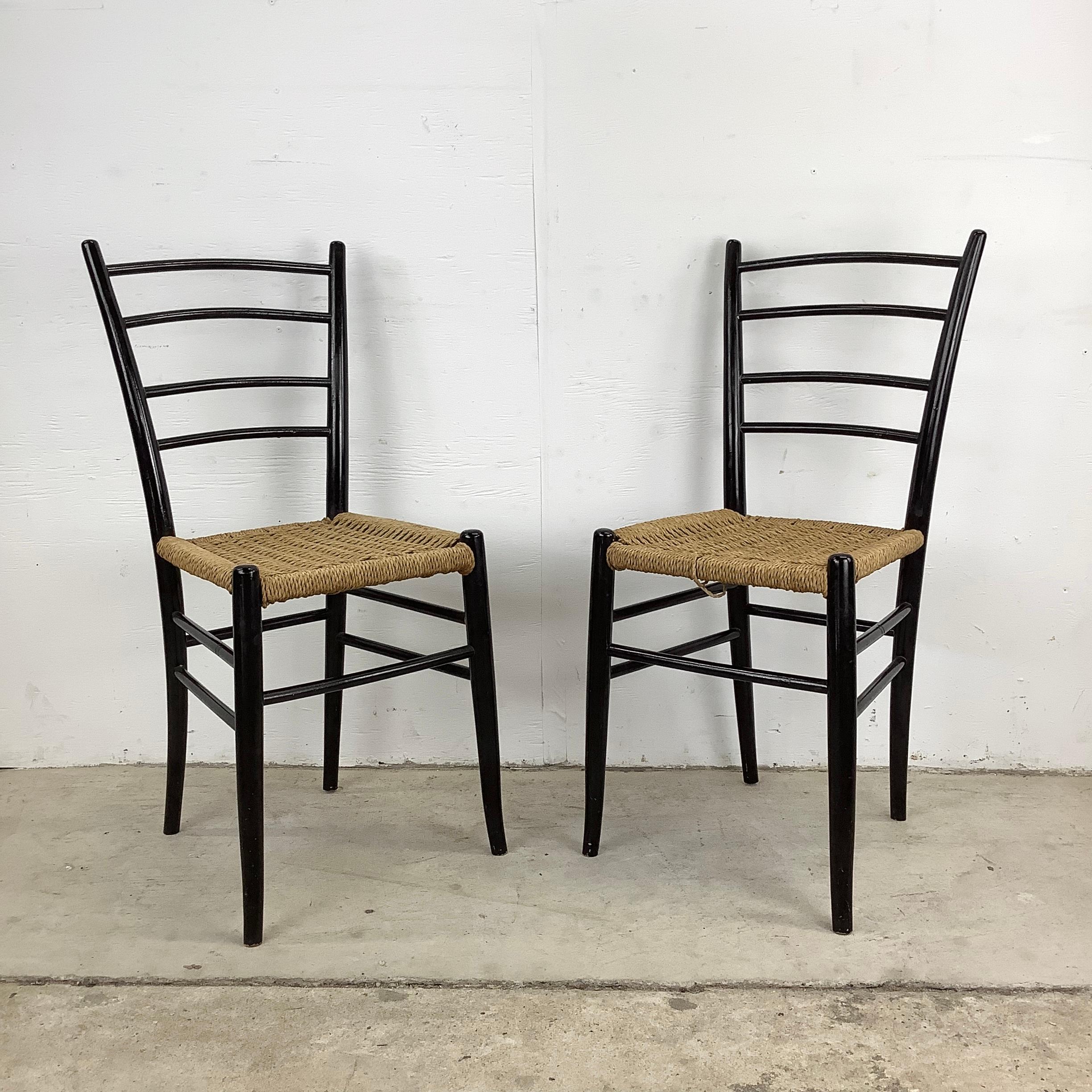 Revel in the allure of mid-century Italian craftsmanship with this set of four vintage rush seat dining chairs, a nod to the timeless designs of artists like Gio Ponti and Chiavari Spinetto. These petite vintage chairs, with their sleek lines and