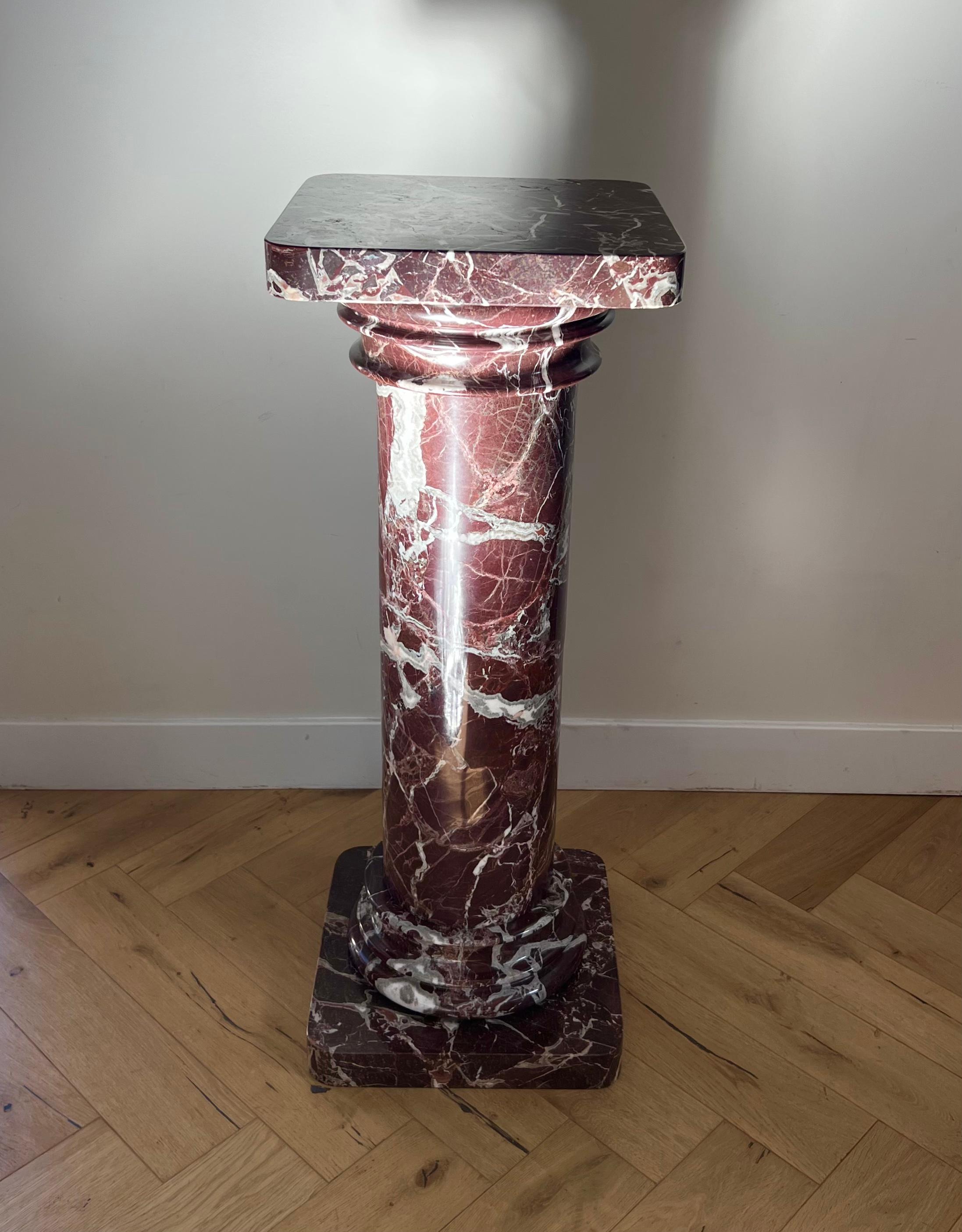 An extraordinarily striking vintage Italian rosso levanto marble pedestal, 20th century. Tones of oxblood, ivory, and dove gray. Neoclassical in form, this column actually disassembles into five pieces for storage and transport. The top piece merely
