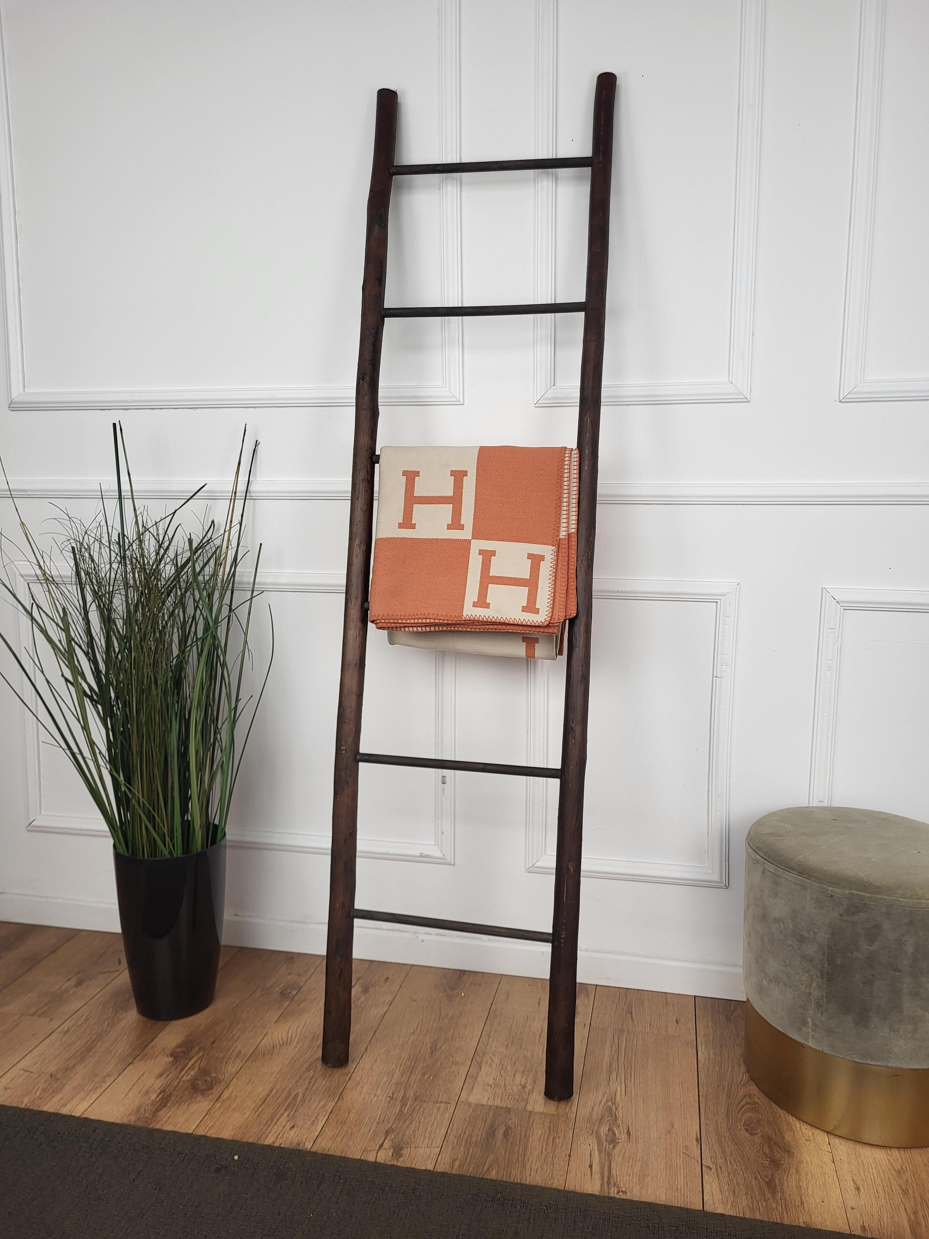 Beautiful rustic ladder crafted of sturdy wood with a simple design and nice patina. Sure to bring lots of character and rustic elegance to any room using minimal space. Great for displaying blankets, towels, lights and holiday decor, or perfect