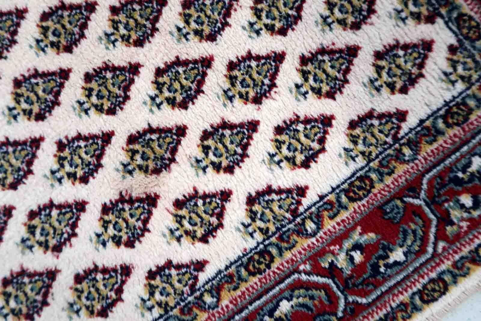 Vintage rug from Italy made in Persian Seraband design. The rug is in original good condition from the end of 20th century. It is machine made piece.

-condition: original good,

-circa: 1970s,

-size: 2.2' x 4.5' (68cm x 140cm),

-material: