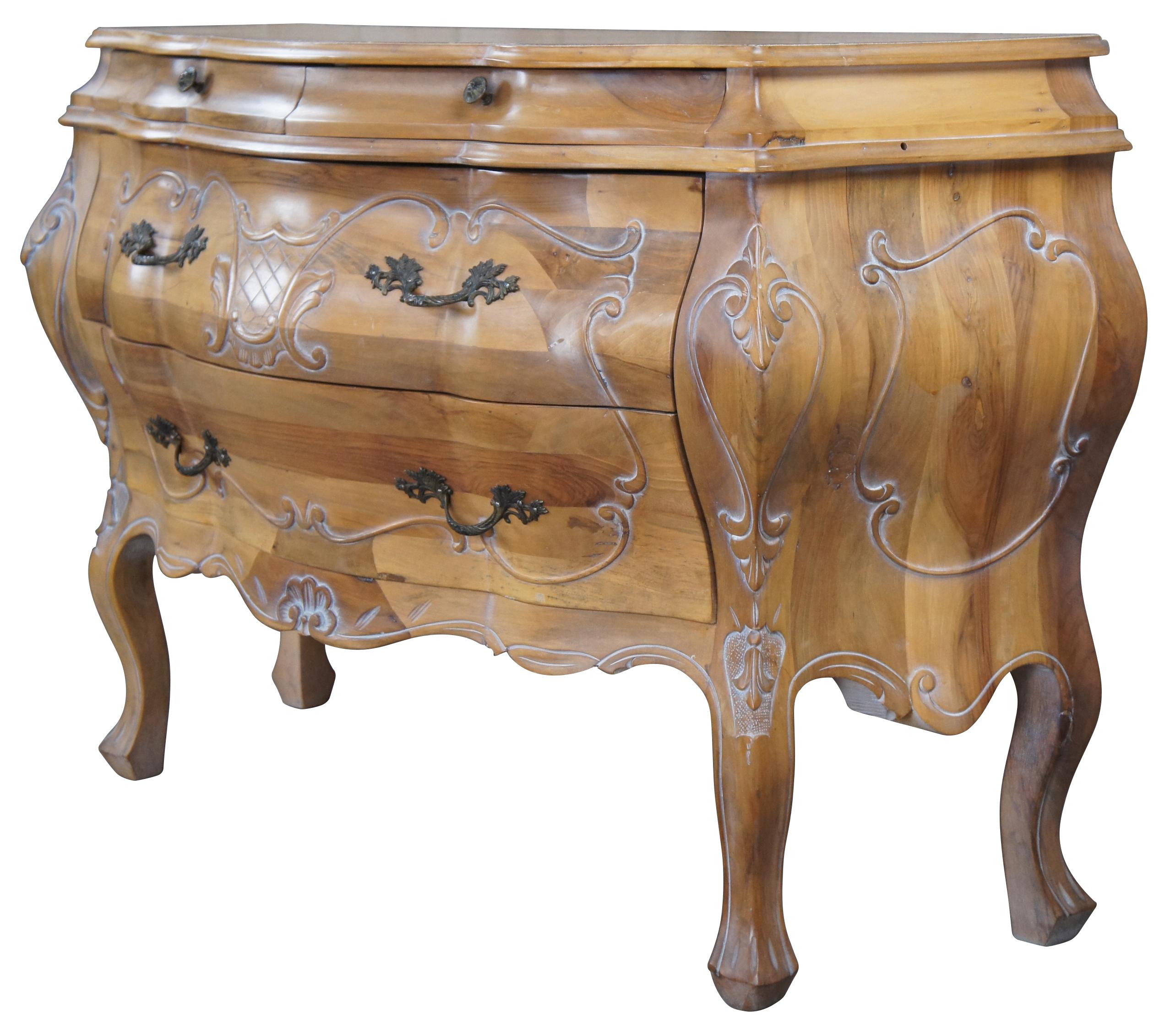 Vintage bombe chest or commode, circa last quarter 20th Century. Made of pine featuring ornate French and Italian styling with two petite glove drawers over two drawers supported by cabriole legs. Marked Italy along backside. Measure: 51