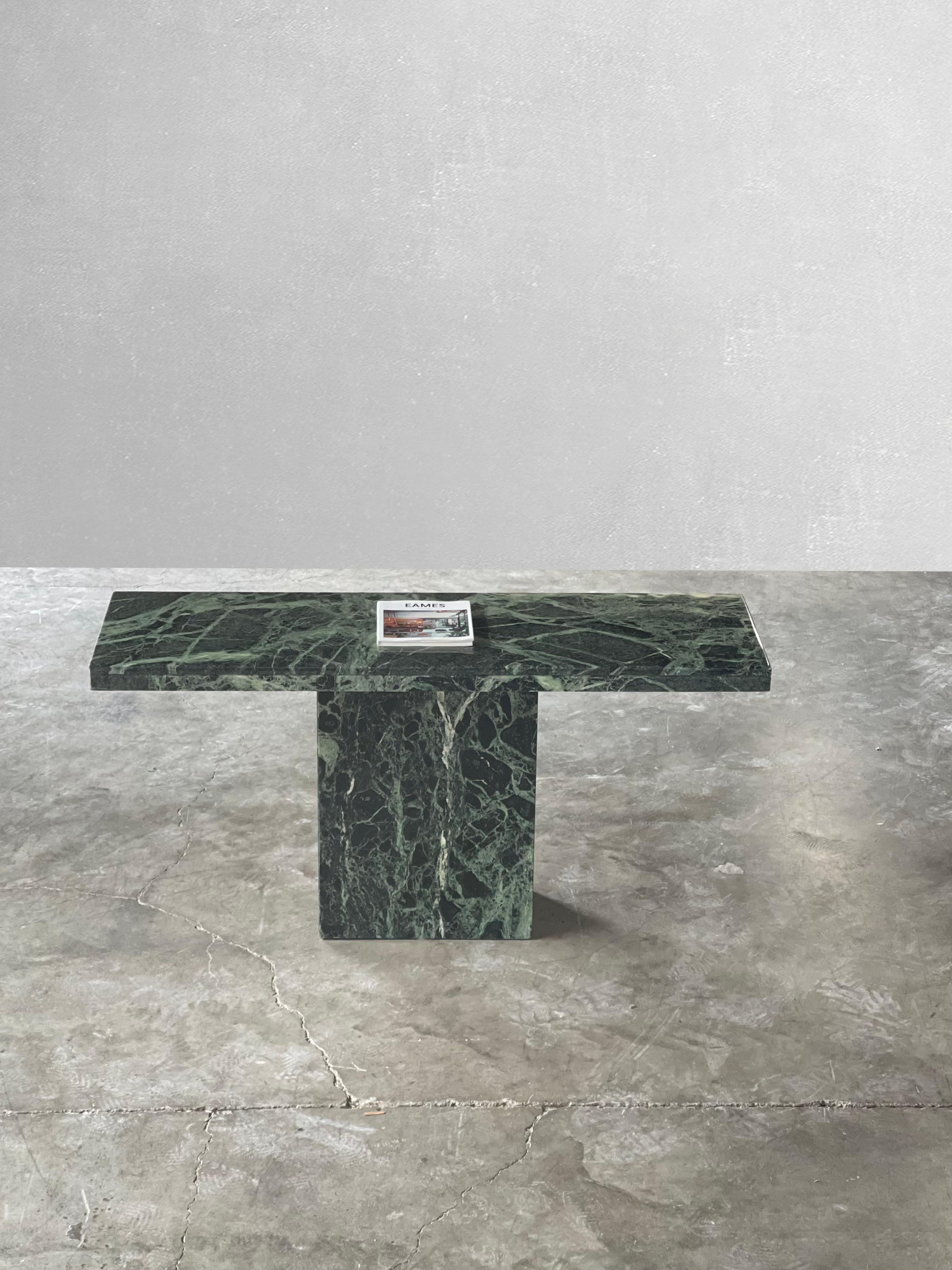 Striking Italian Green Serpentine Marble Console Table. 

C. 1980

Rectangular serpentine green marble table with beautiful edge detail and matching base. Love the natural movement and different shades of green. 

Tagged made in