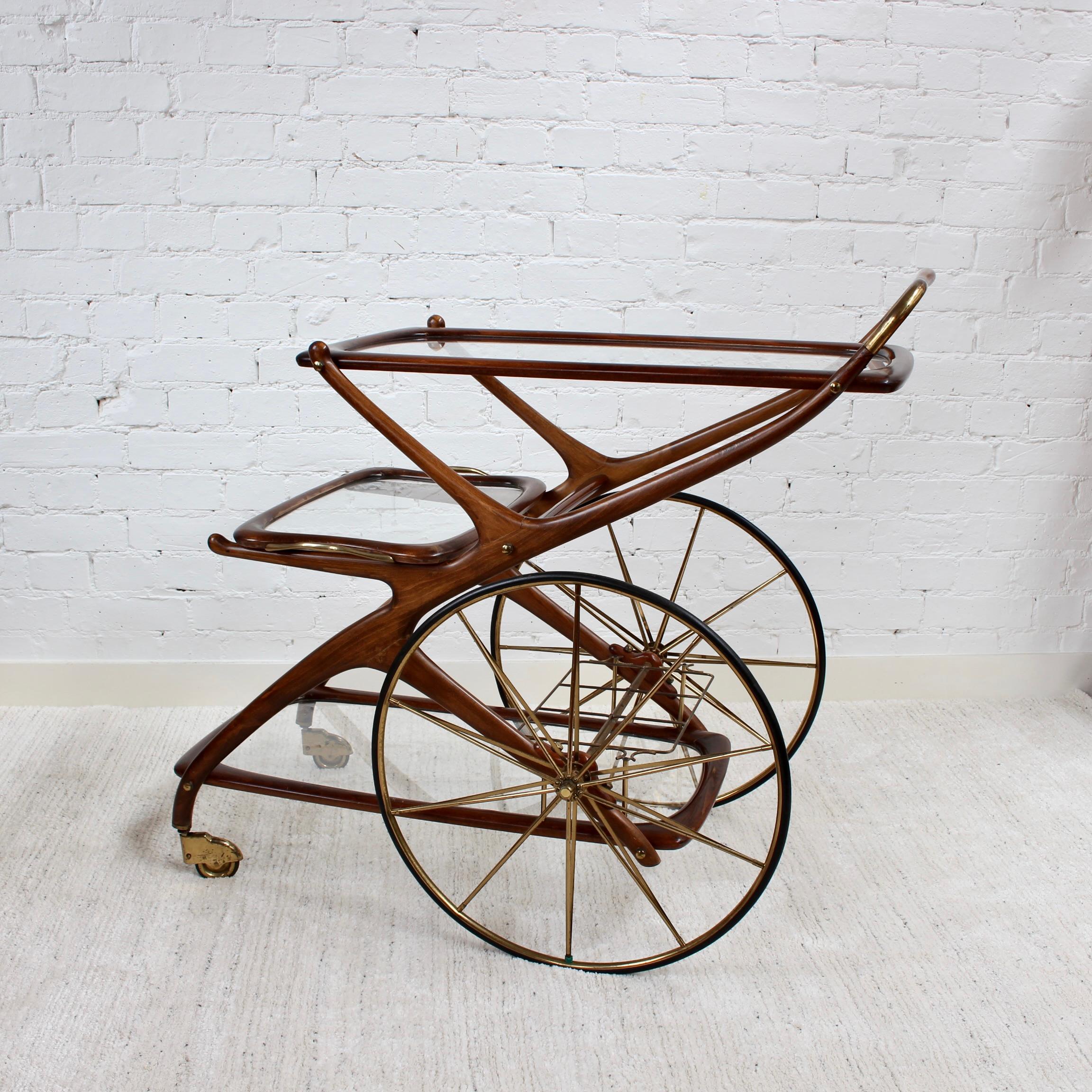 Vintage Italian serving trolley / bar cart (circa 1950s) by Cesare Lacca. Mid-century chic, Modern style and pure elegance in wood, brass and glass. Wheel your drinks and snacks out in style on this elegantly attractive piece of design history.