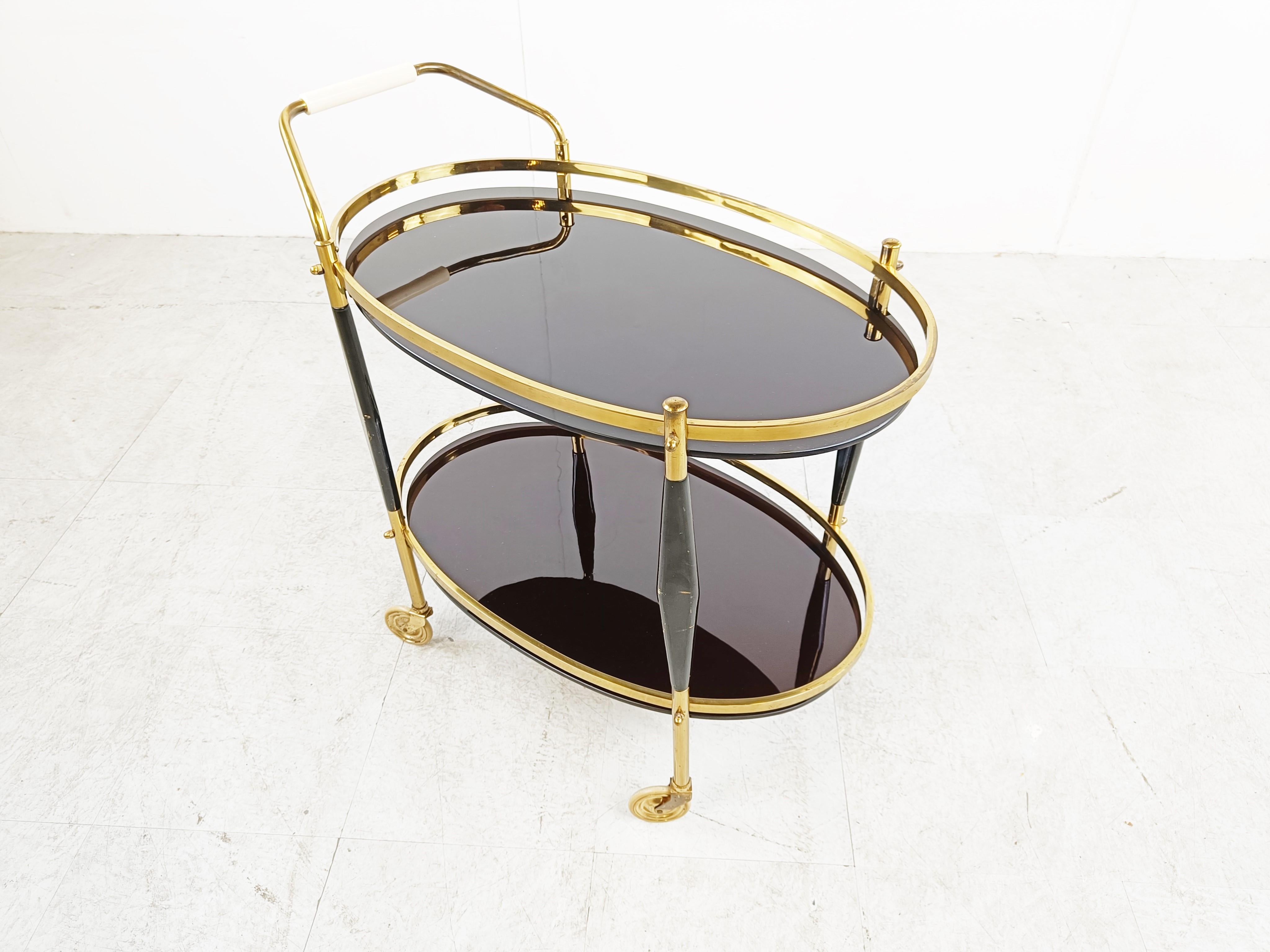 Mid century serving trolley by Cesare Lacca.

Beautiful black lacquered wooden and brass frame with black glasses.

1950s - Italy

Dimensions:
Height: 72cm/28.34