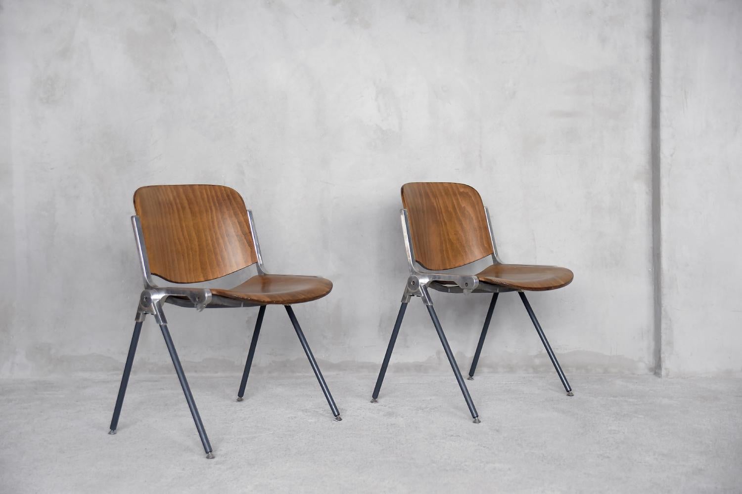 This set of two chairs was made by an Italian manufacture during the 1960s. The frame is made of anodized aluminum. The seat and backrest are made of bent plywood. The furniture made of this material combines the simply form with the natural
