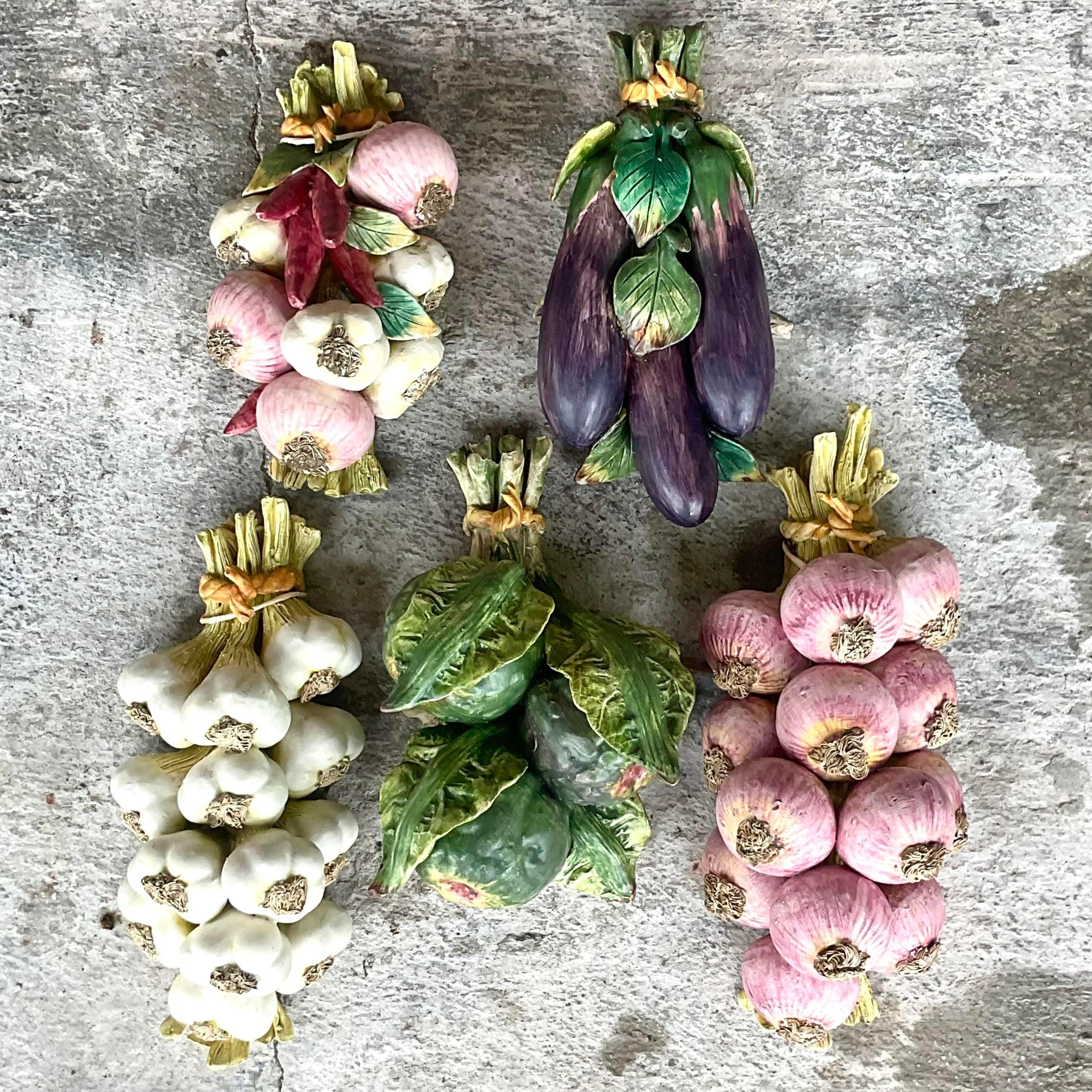 An exceptional set of 5 vintage ceramic vegetable bundles. Made in Italy and signed on the back. A beautiful rustic selection of different heart vegetables. Acquired from a Palm Beach estate.

White garlic 7x4x12
Pink garlic 7x4.5x15
Artichokes