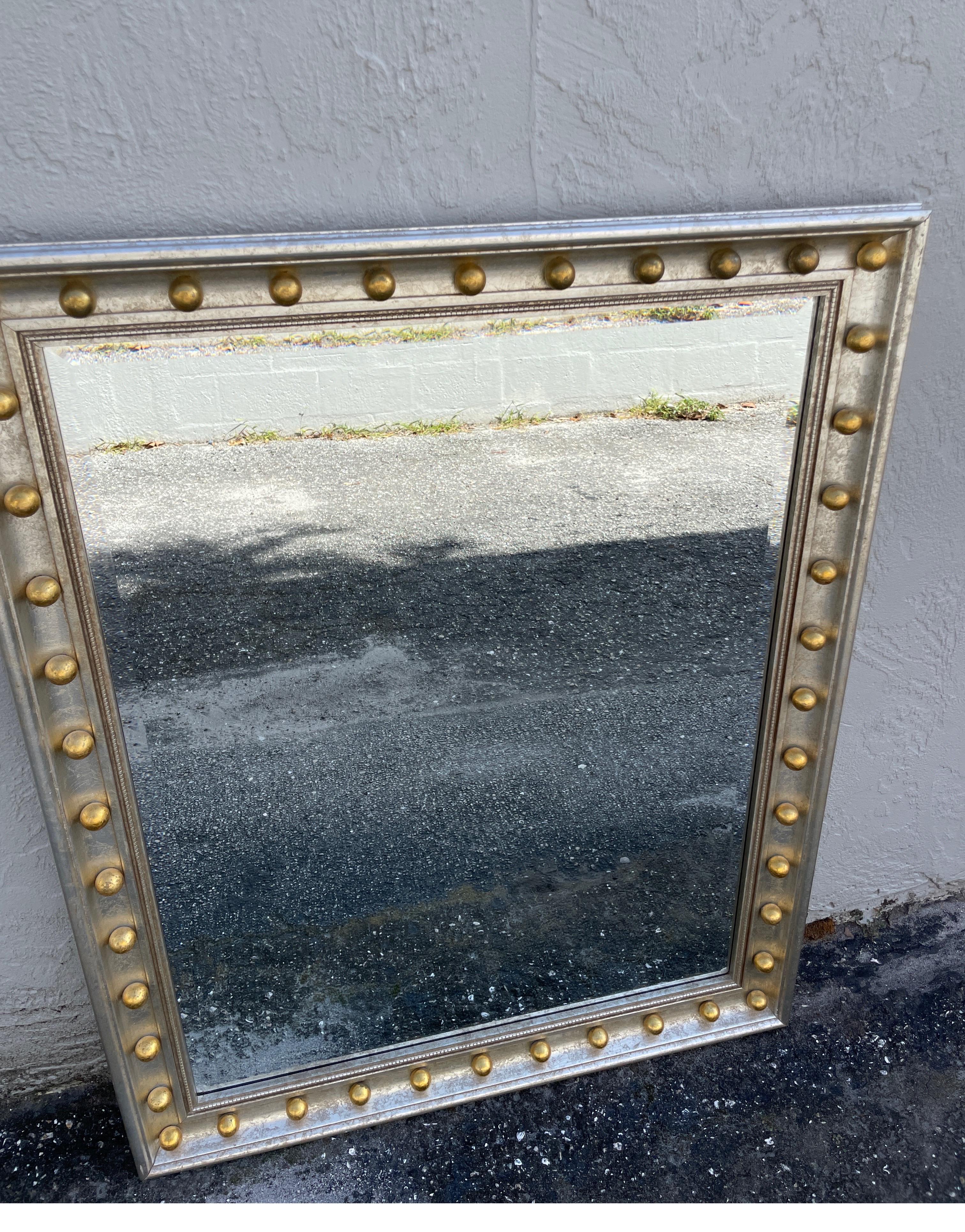 Vintage rectangular silver giltwood mirror with gold gilt circular balls on all sides. A very unusual and striking mirror.