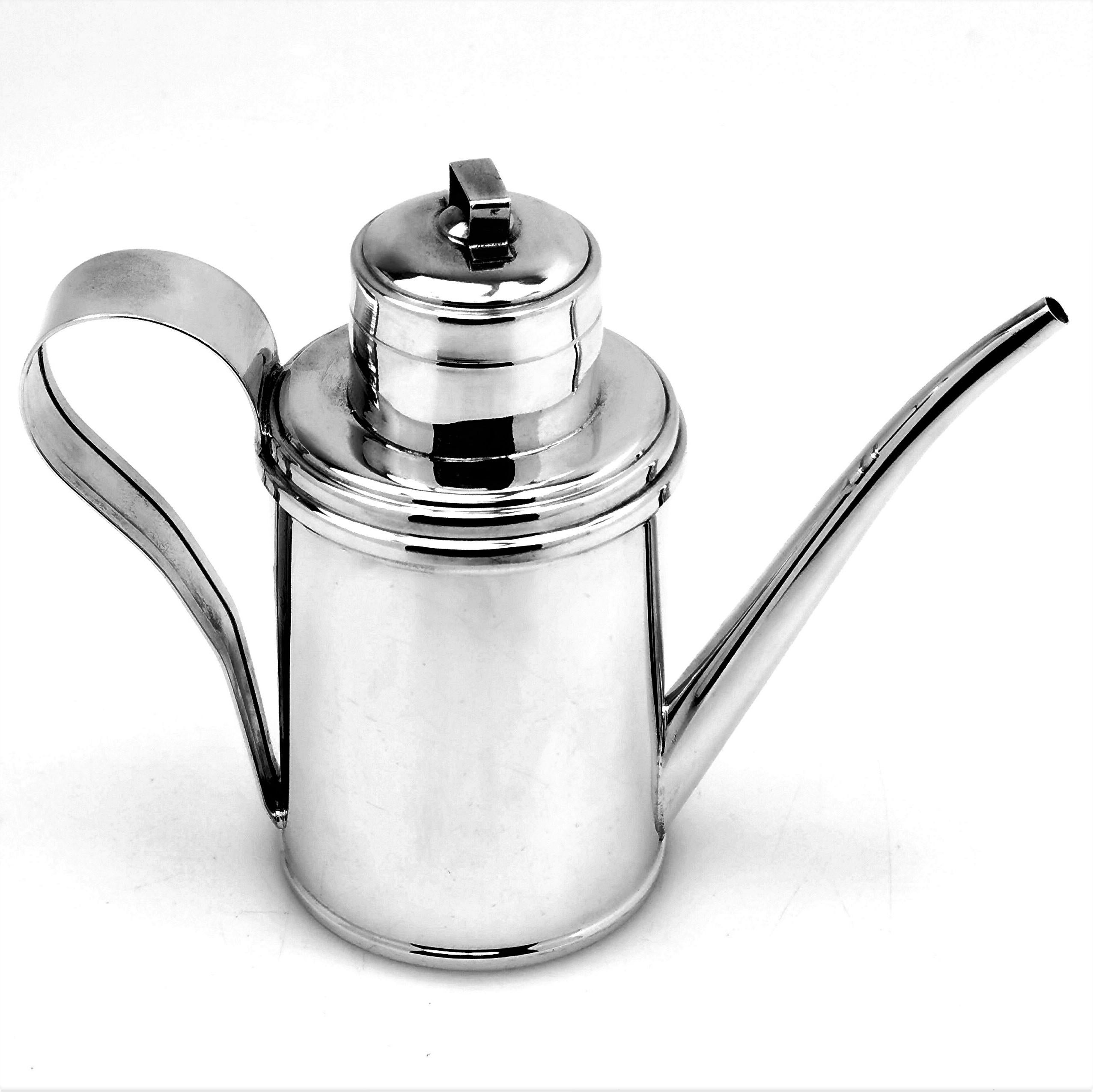A stylish vintage Italian solid Silver Olive Oil Jug with an understated elegant design. This Olive Oil Drizzler has a classic can shaped body and an long tapered spout with a push fit lid. 

Made in Italy in circa 1960.

Approx. Weight - 264g /