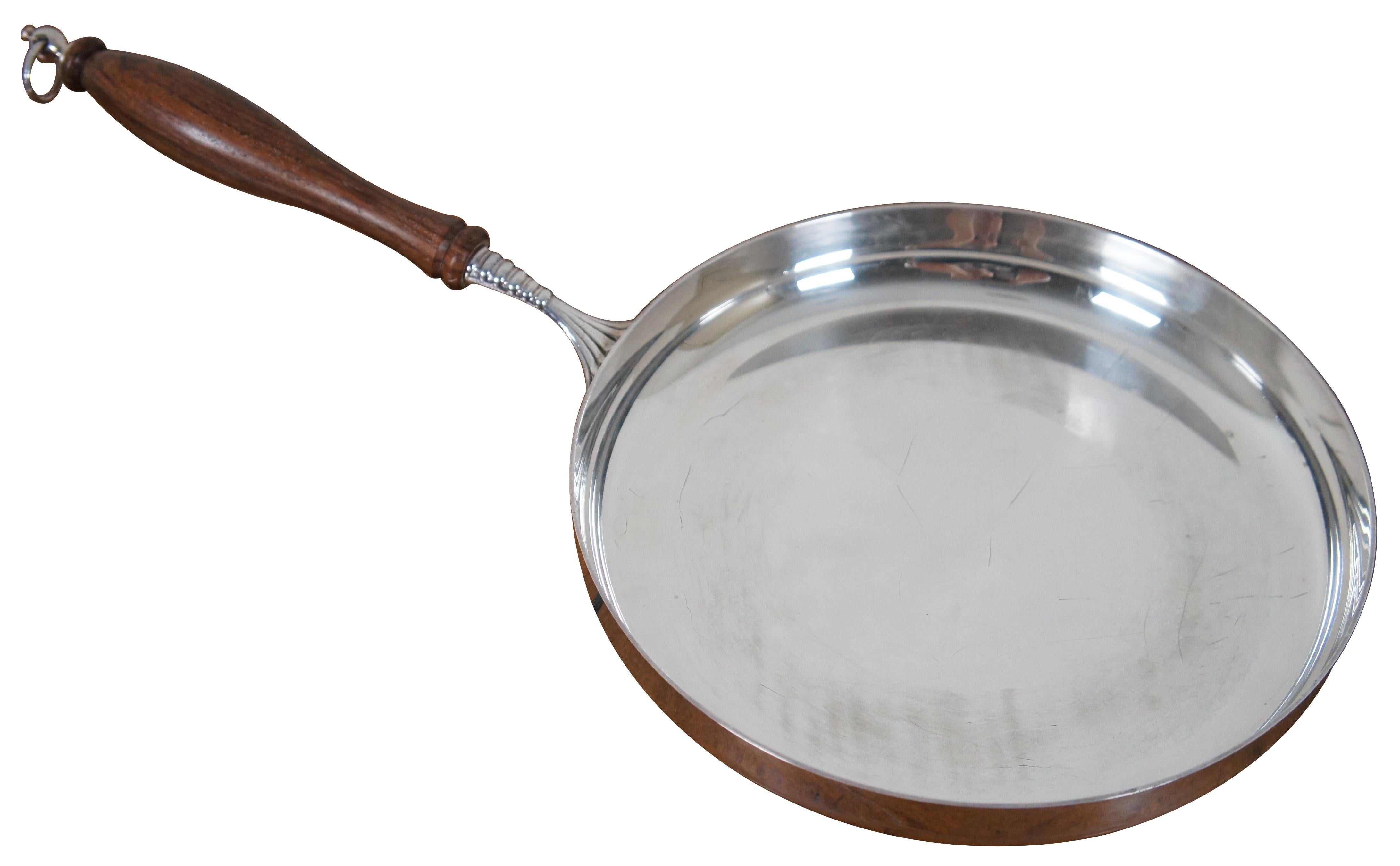 Vintage Italian silver plate frying pan or skillet with wooden handle and hanging ring. Marked Italy with a logo that appears to be a P above and M.
