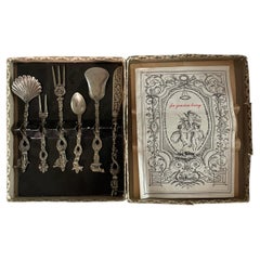 Ensemble vintage italien de couverts de service figuratifs en métal argenté, dans son emballage d'origine