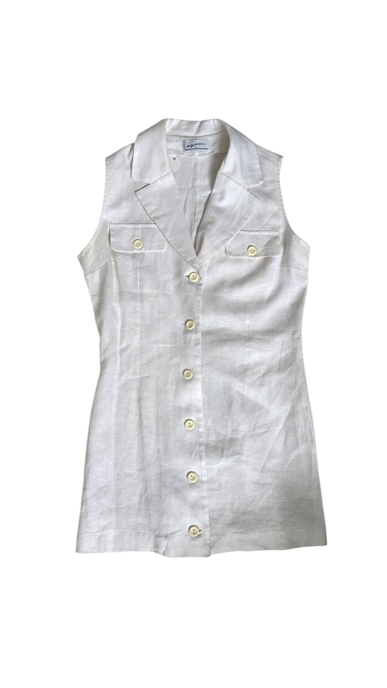 Effortlessly chic and timelessly versatile, this vintage sleeveless dress Made in Italy by Maggy Modas is crafted from pure linen in a crisp white hue. Designed in a flattering shirt-dress silhouette, it features a structured collar, button-down
