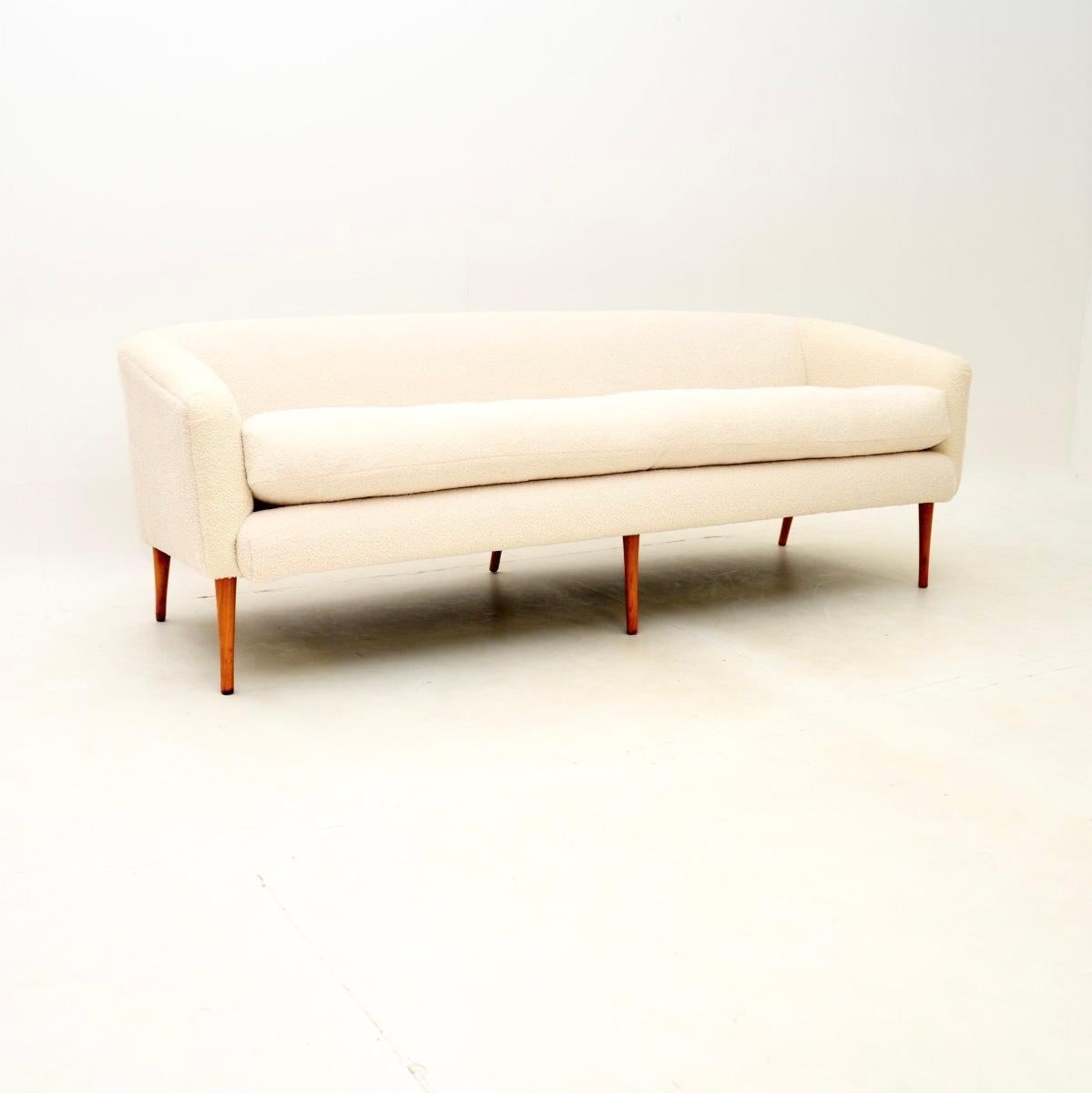 A sleek and extremely stylish vintage Italian sofa, dating from the 1960’s.

This has a stunning design, it is of superb quality and is comfortable to sit in. It sits on six solid birch legs which have a lovely tapered design. The long seat cushion