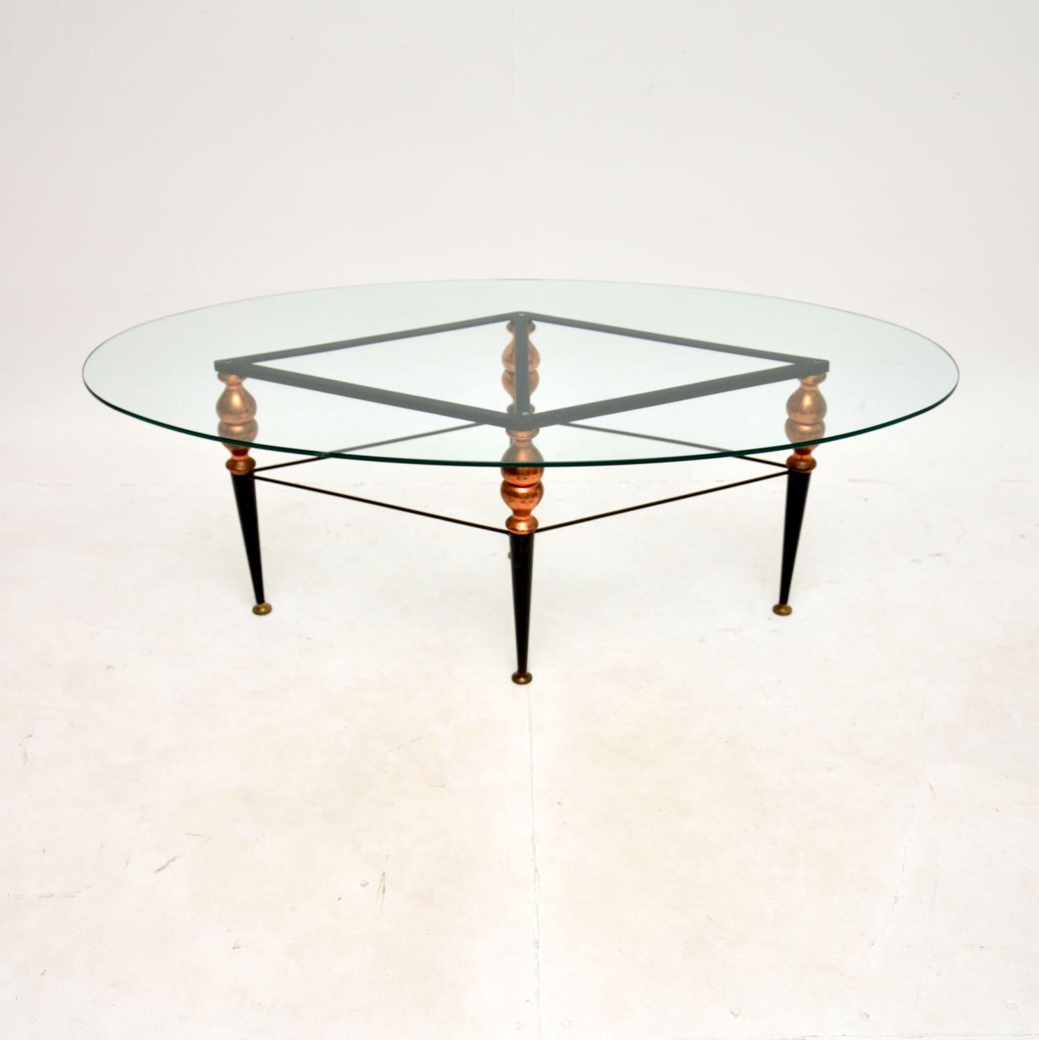 A stylish and very well made vintage Italian steel and copper coffee table. This was recently imported from Italy, it dates from around the 1960’s.

The quality is superb, the large clear toughened glass oval top sits on a beautifully designed base.