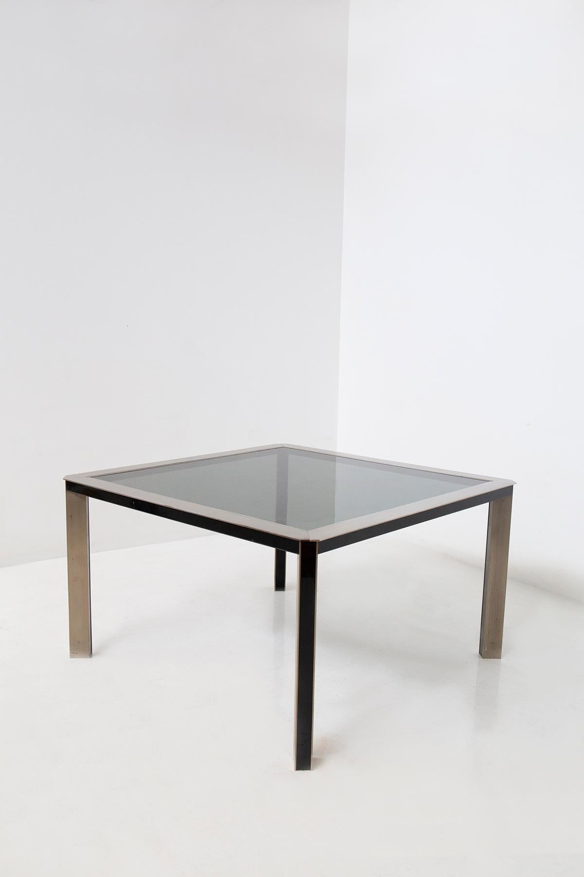 In the world of interior design, there are pieces that stand as timeless icons of a bygone era, and your vintage Italian steel and glass dining table from the 1970s is unquestionably one of them. This remarkable piece of furniture encapsulates the