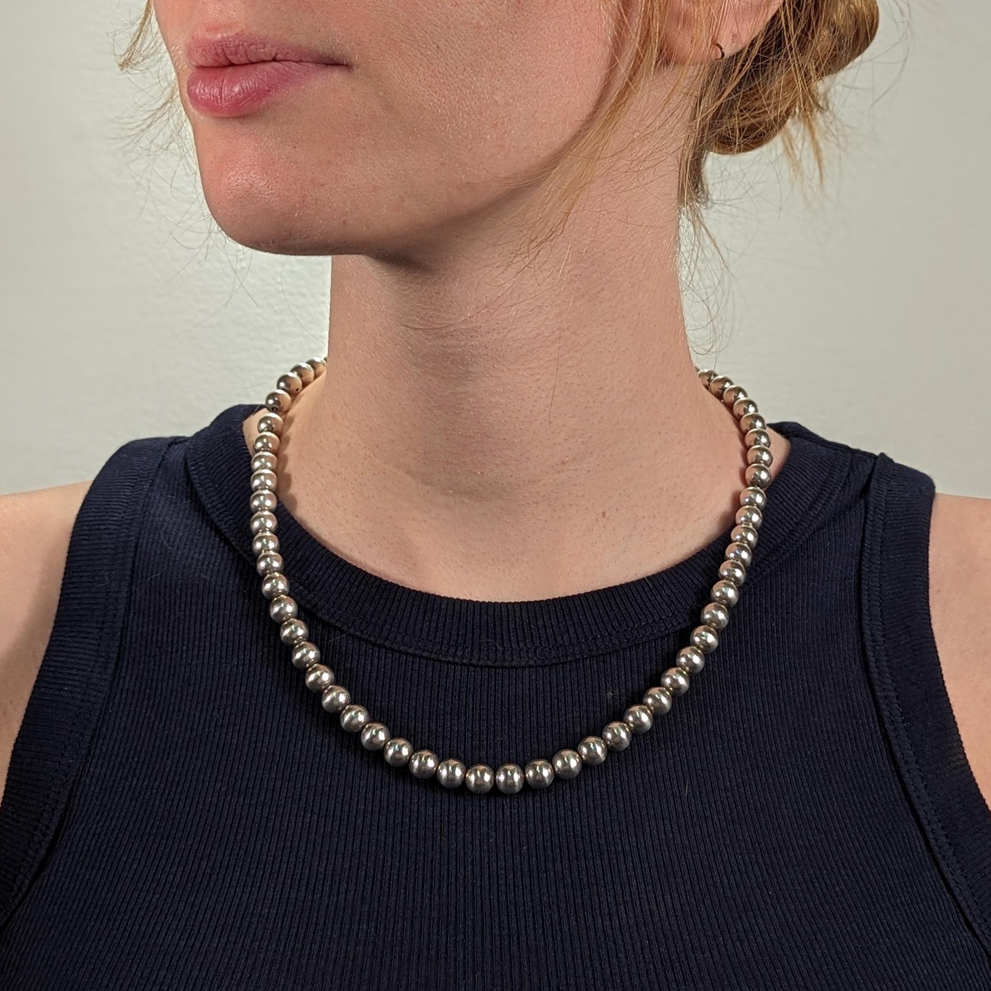 A fine silver beaded necklace.

In sterling silver.

Comprised of 63 8mm sterling silver beads.

Marked to the clasp for 925 / Italy.

Simply a wonderful necklace!

Date:
20th Century

Overall Condition:
It is in overall good, as-pictured, used