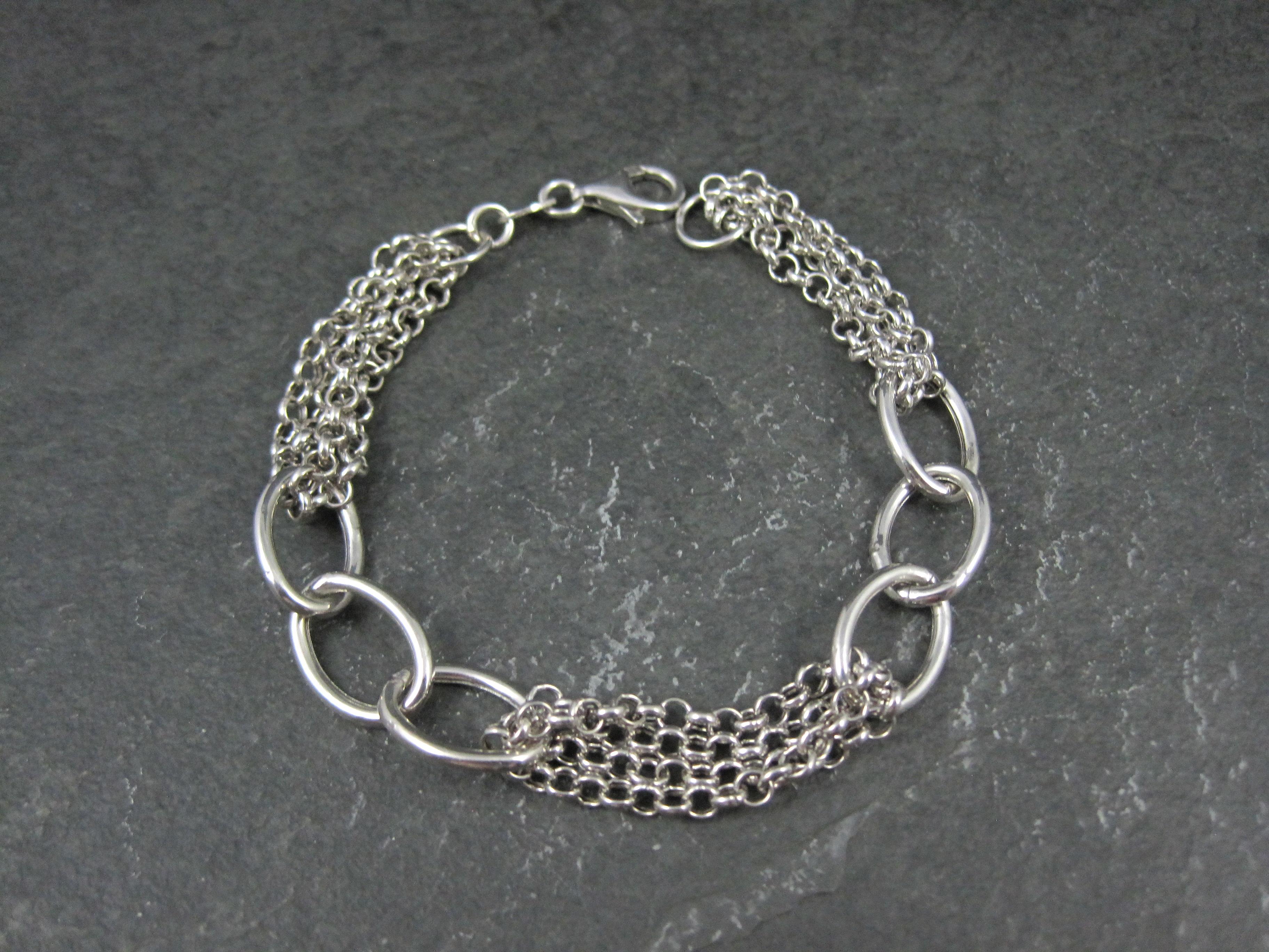 This beautiful Italian bracelet is sterling silver. It is a product of Heier Jewelry.
It features an alternating design featuring chain and oval links.
Measurements: 7/16 of an inch at its widest, 7 1/2 inches from end to end
Weight: 6.7