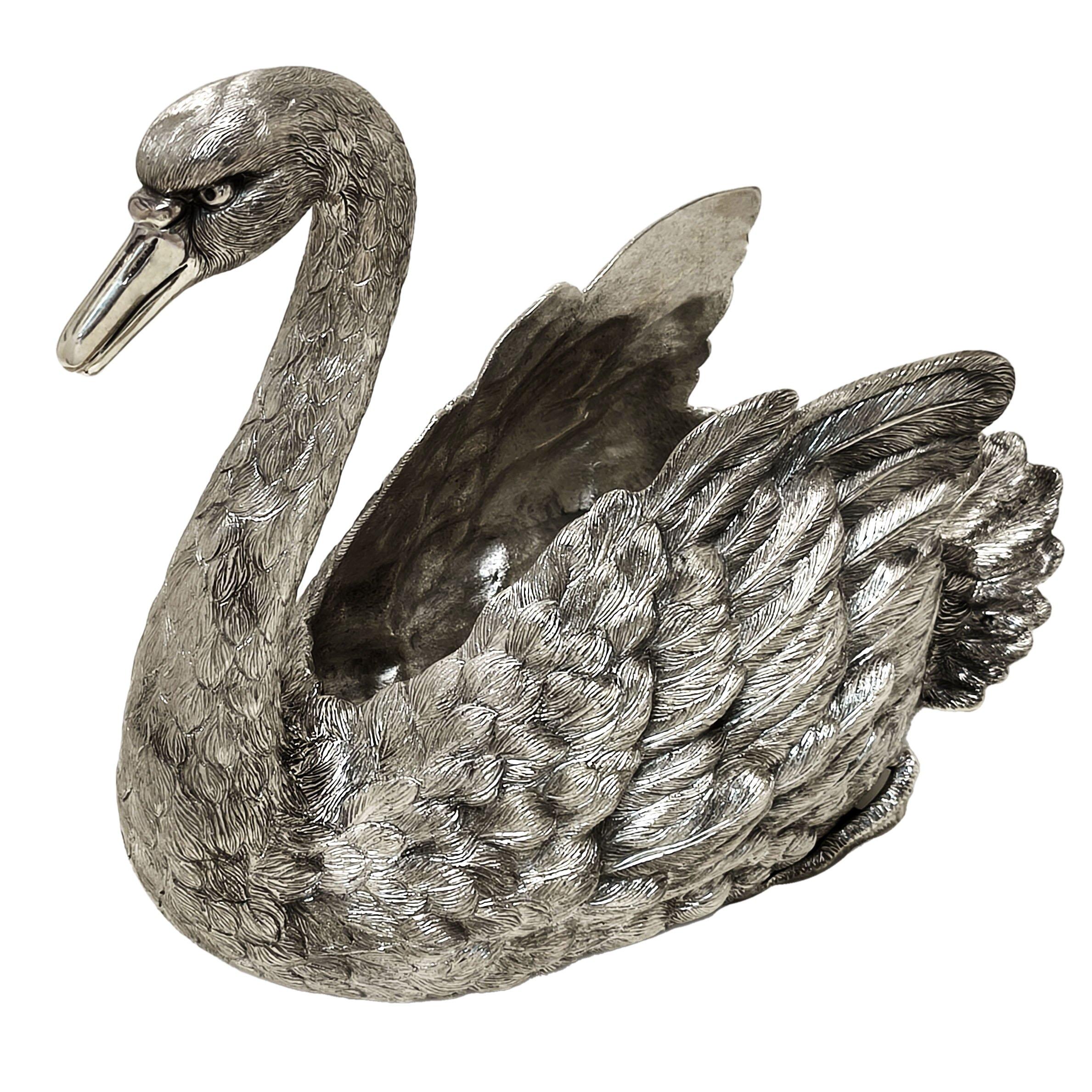 A beautiful Italian Silver Swan Centrepiece modelled with a lovely attention to detail. This Swan is suitable as a Jardiniere, a Bowl or a Champagne Cooler.

Made in Italy in c. 1920.

Approx. Weight - 2564g
Approx. Height - 25cm
Approx. Length -