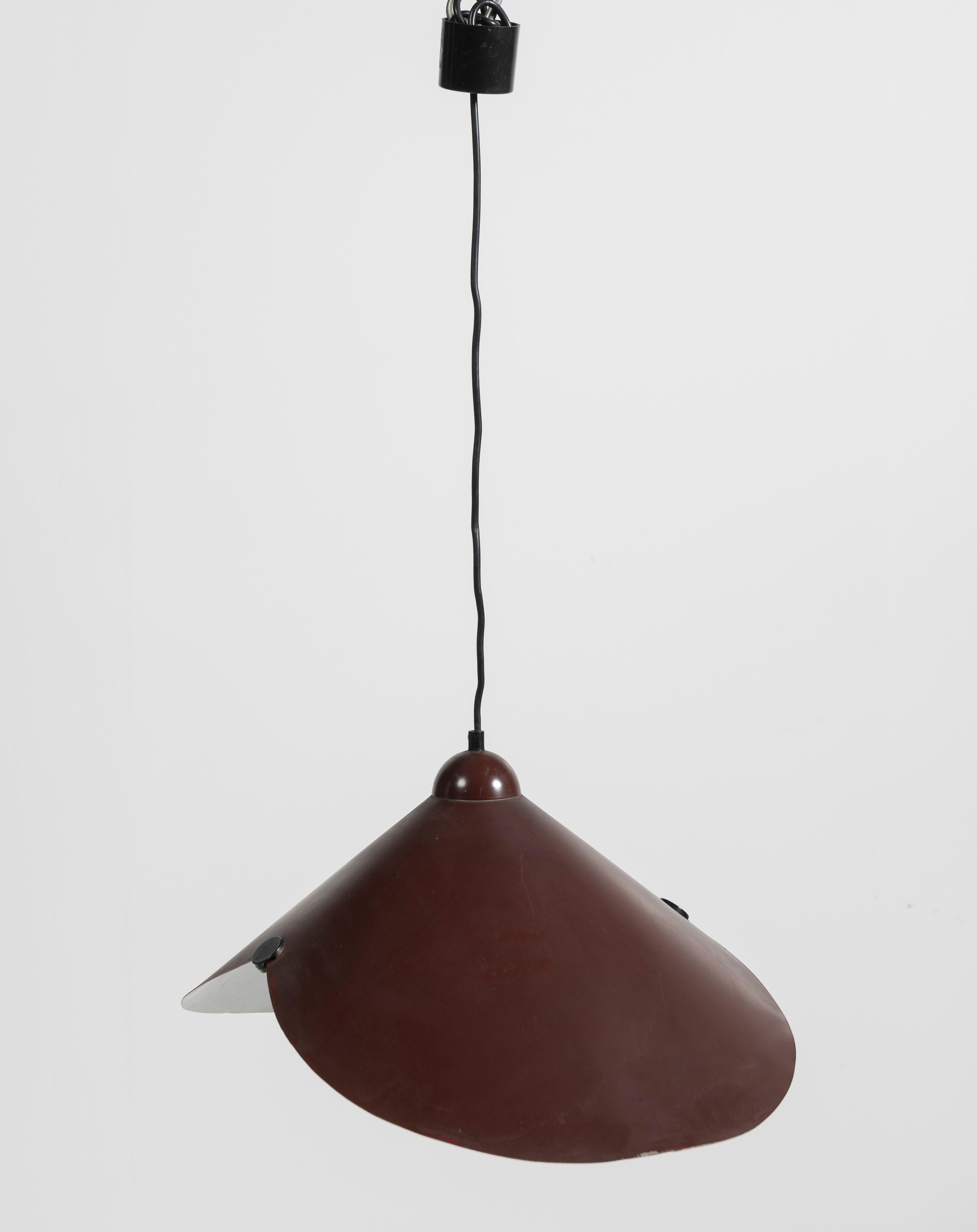 Vintage Mid-Century Modern pendant by attributed to Stilnova is perfect over a table, counter or bar. With its deep red outer shade and white interior, it also adds a pop of color to your space. The pendant overall drop height is 60