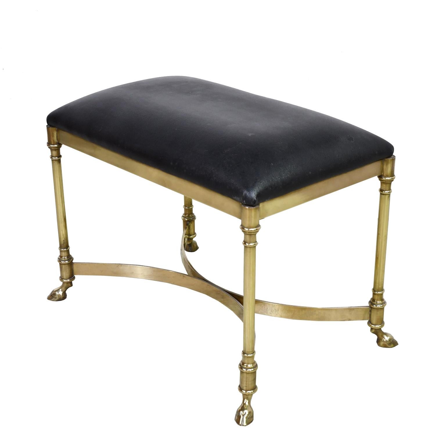 A lovely Italian stool in the neoclassical style with gleaming brass frame with double crescent stretcher and hoof feet. Upholstered in vintage black stippled faux leather. Italy, circa 1960.

Measures: 25” long x 15” wide x 18” high.


