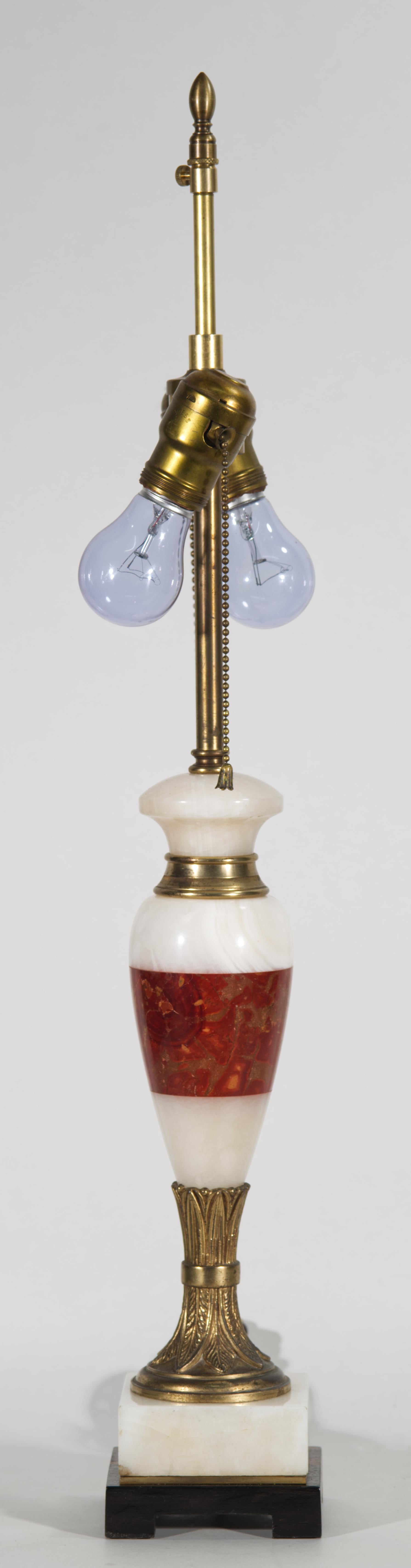 Vintage urn or baluster lamp features elongated body, formed of carved marble and alabaster with bronze accent on the neck of the lamp, mounted on highly detailed bronze foot and square alabaster and gilded wood base. The beautiful white and red