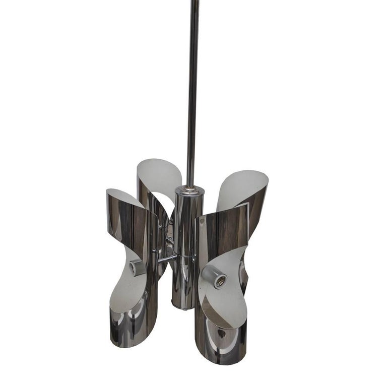 Vintage Italian style midcentury chrome chandelier 'MR15346'

Unique cylinder shaped chrome four bulb fixture with sculptural curves and a long stem to accommodate high ceilings and entryways.
Measuring: Overall height 50