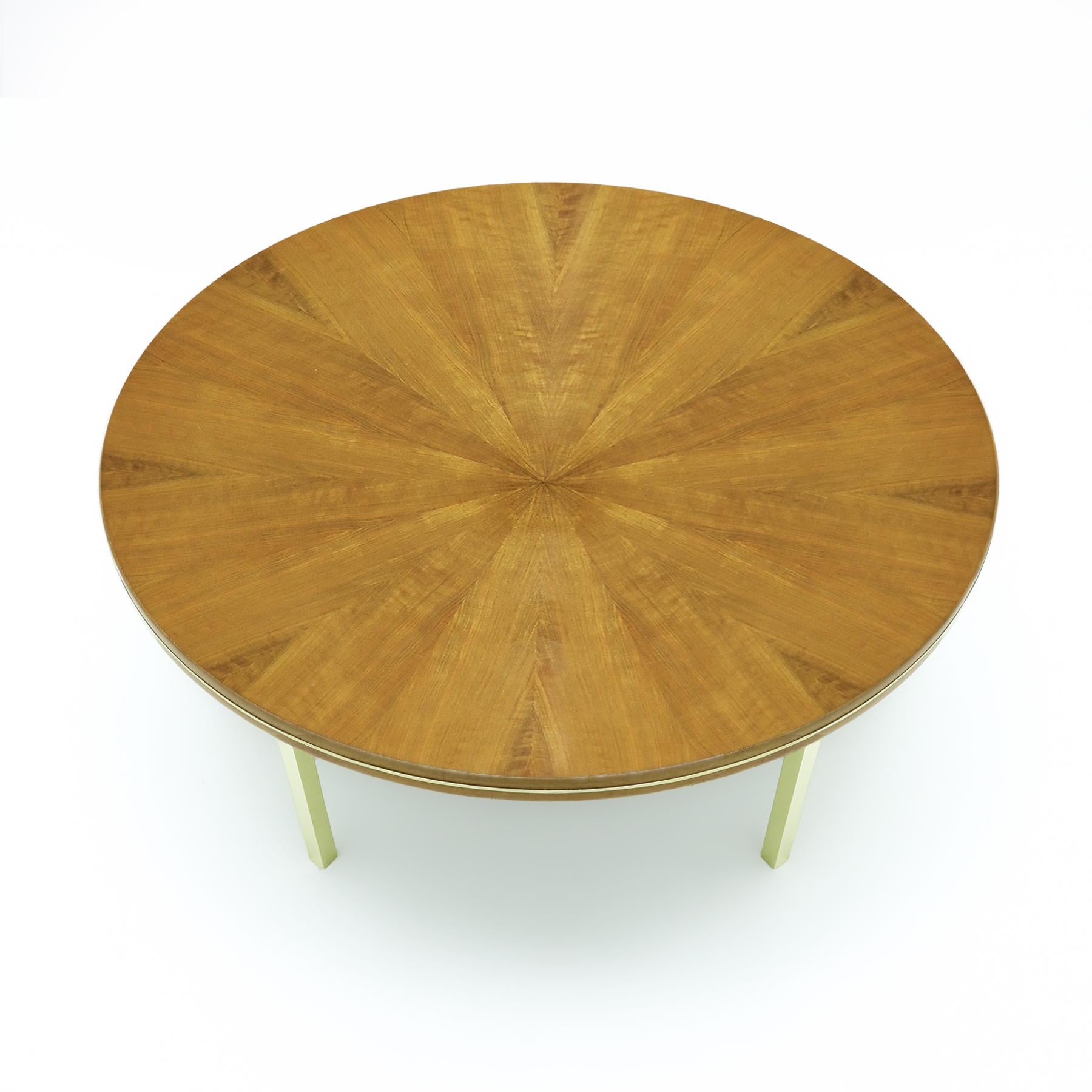 Exceptional vintage Italian teak Sunburst effect coffee table with a satin polished brass base.

The sunburst design for table tops can be found in many vintage mid century designs from Denmark, in the Georg Jensen Kubus table, to the UK with tables
