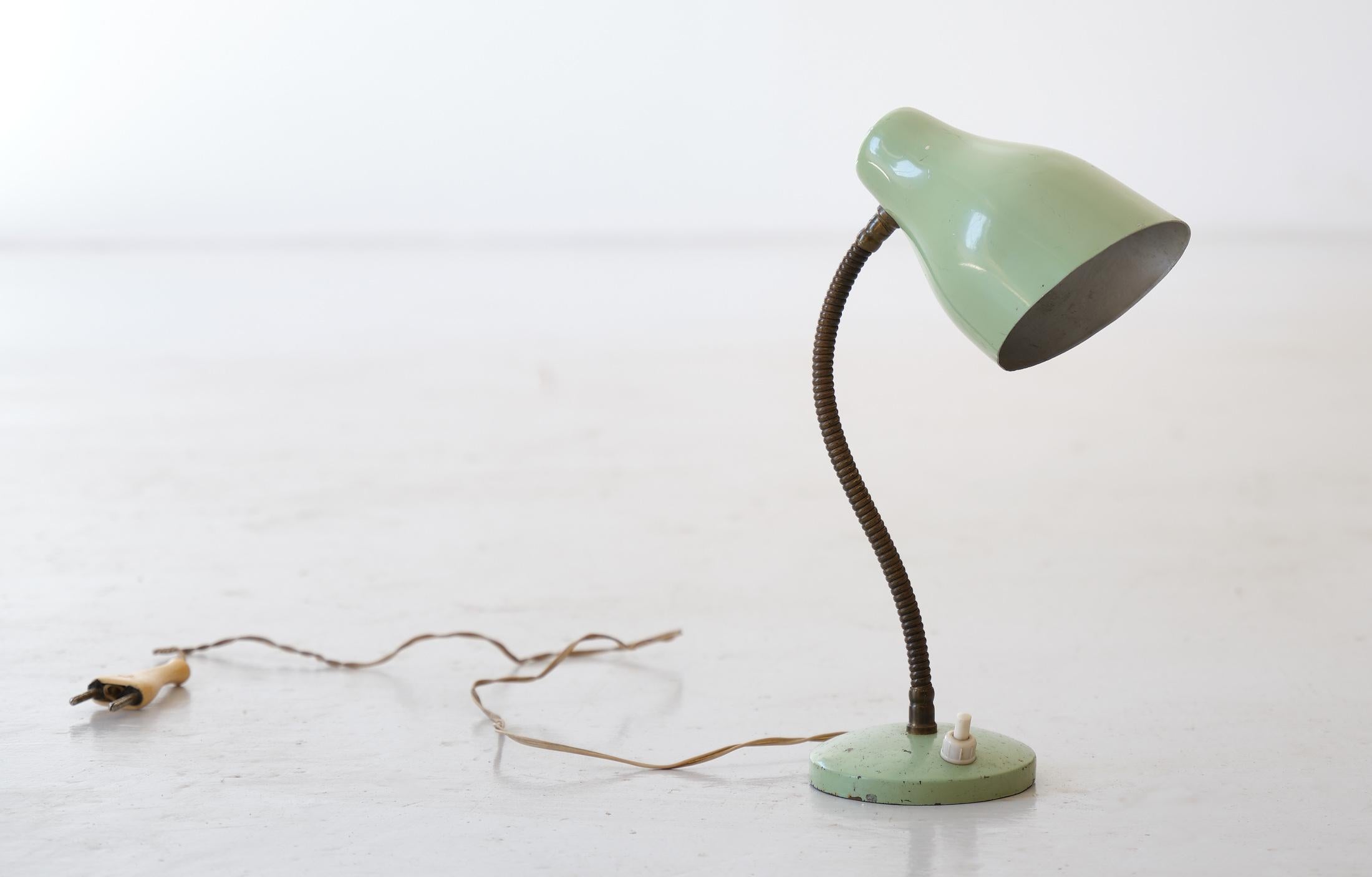 Small vintage table or bedside lamp, made of brass and green-colored enamelled metal, Italy, 1950's.

This abat jour is in good vintage condition.
Original working wire with standard E14 bulbs. We can supply USA plug adapter if needed.