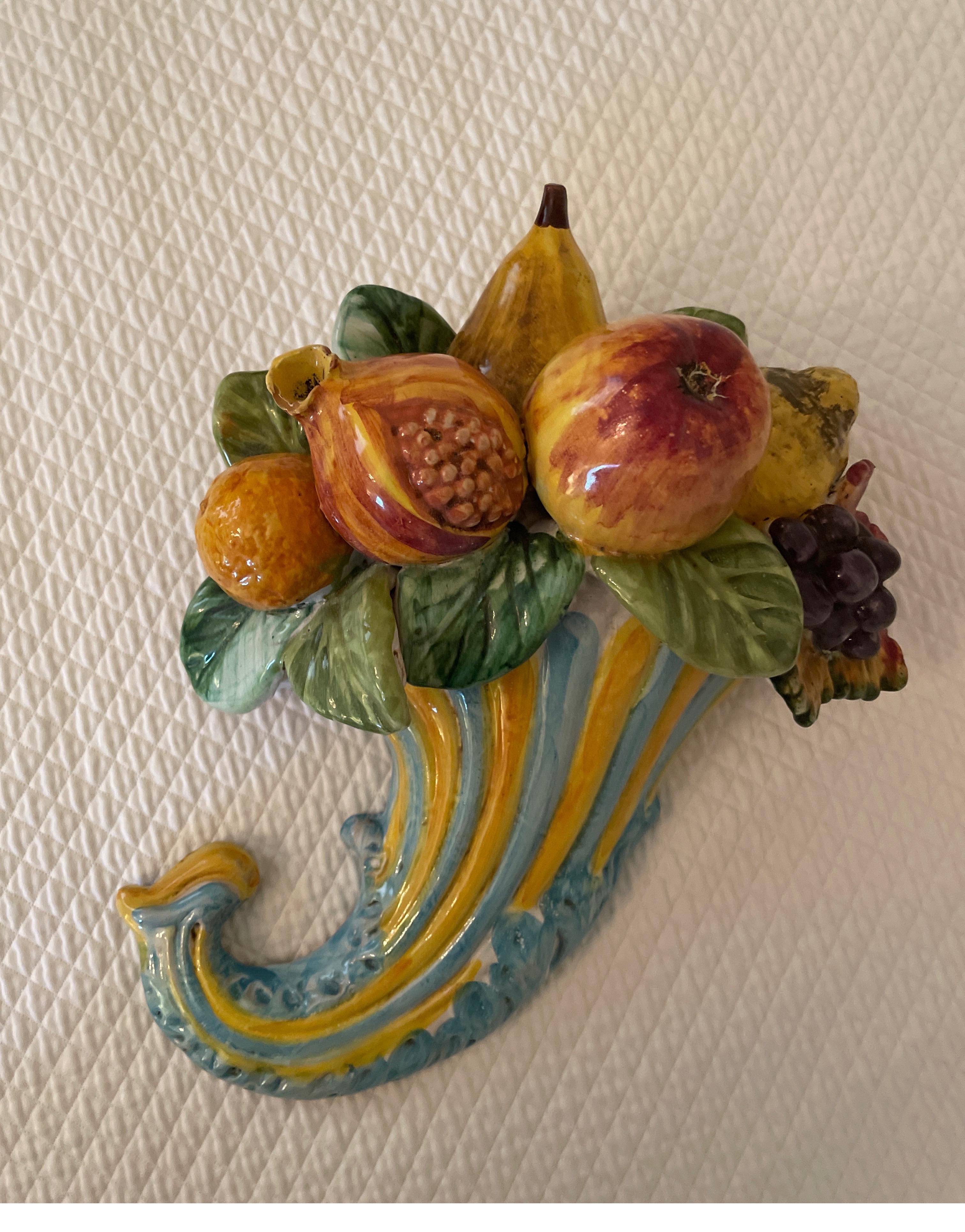 Vintage multicolored terra cotta cornucopia wall hanging of assorted fruits. Very pretty piece for a kitchen / breakfast room.