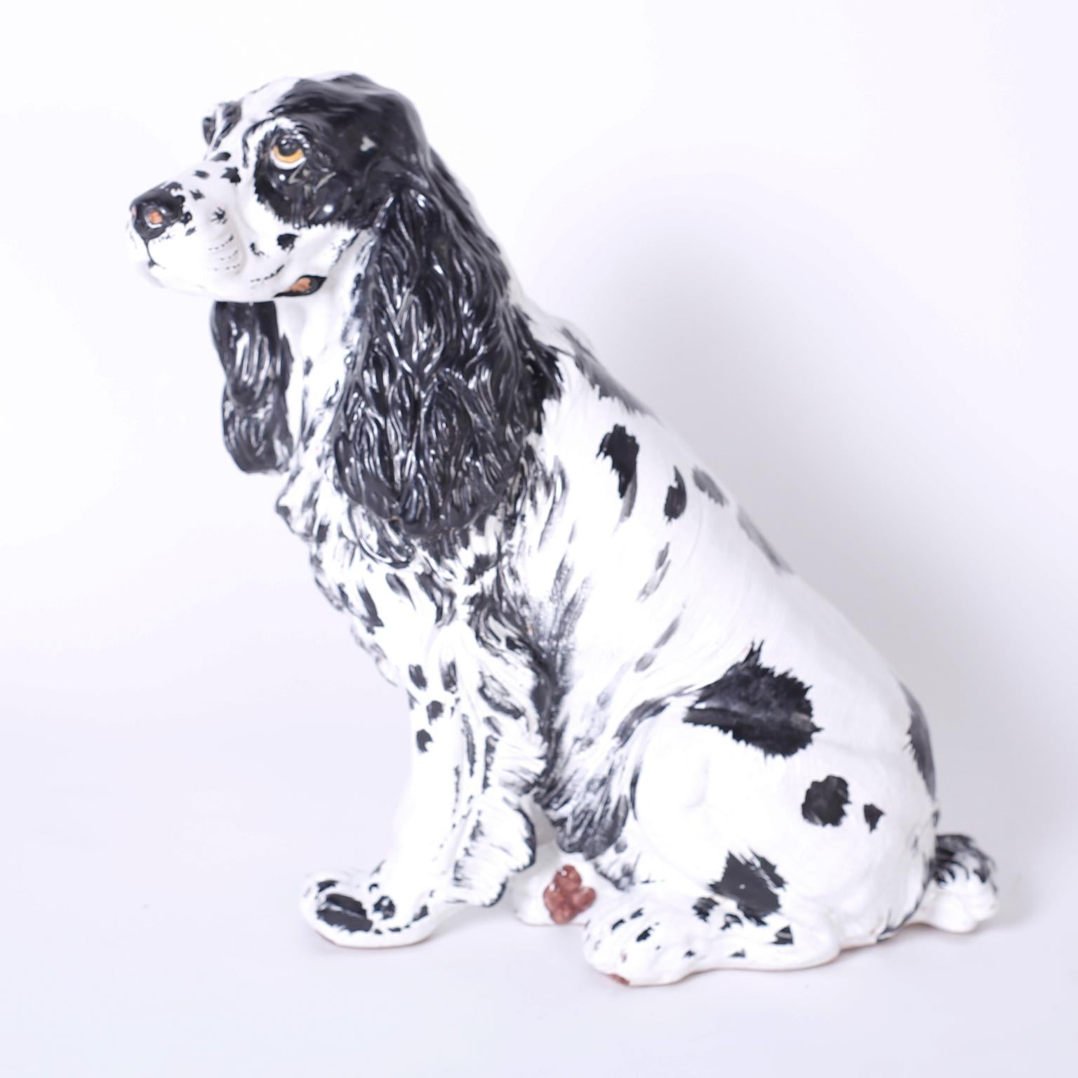 Life size Italian decorated and glazed terra cotta cocker spaniel with enchanting soulful expression and exacting stance.