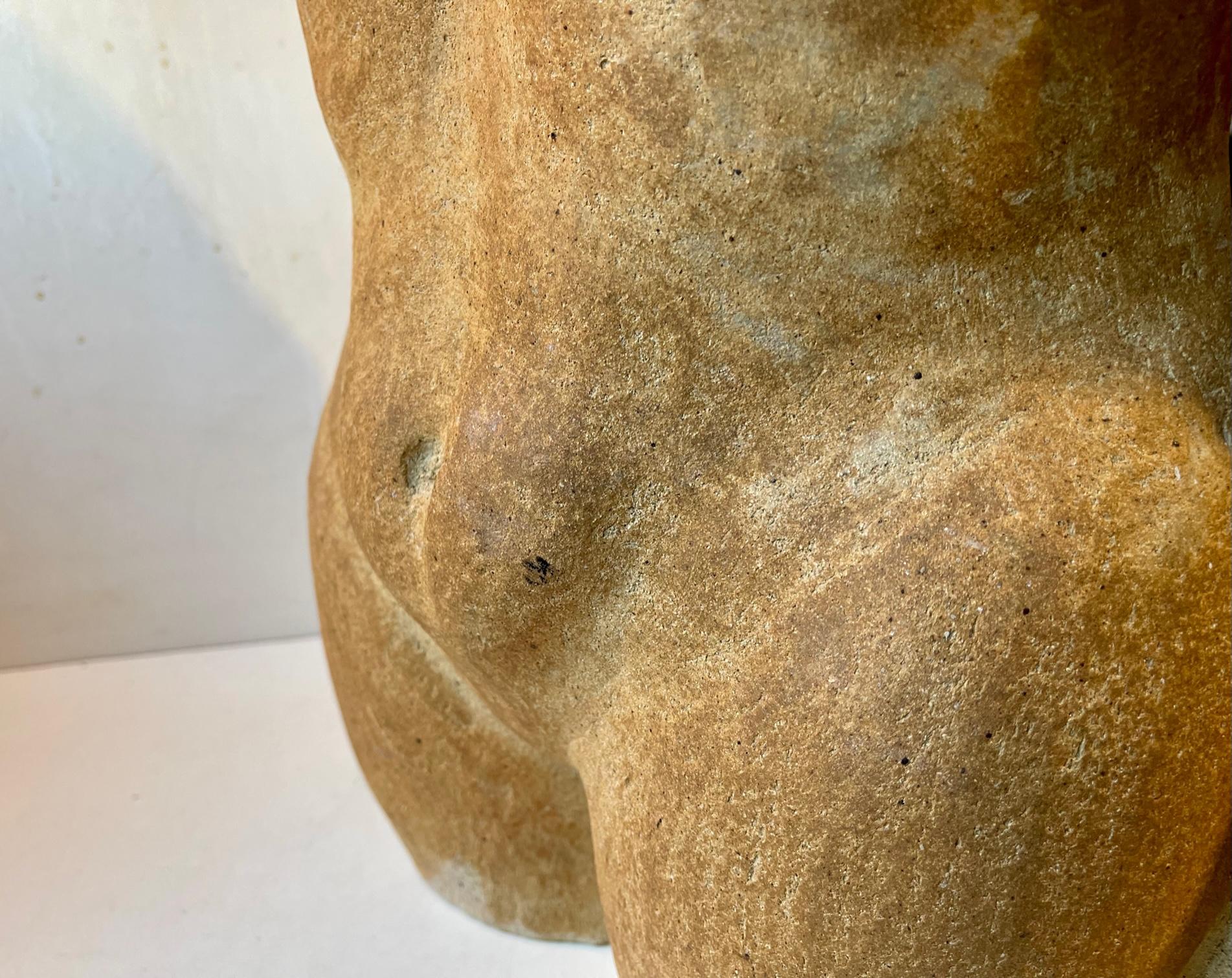 A lush sculptural depicting of a nude female torso. Executed in burnt terracotta stoneware. Bought in and anonymously made in Italy circa 1930-50 according to the Verona Antique dealer. It has no markings. Its patina suggest that it may have been