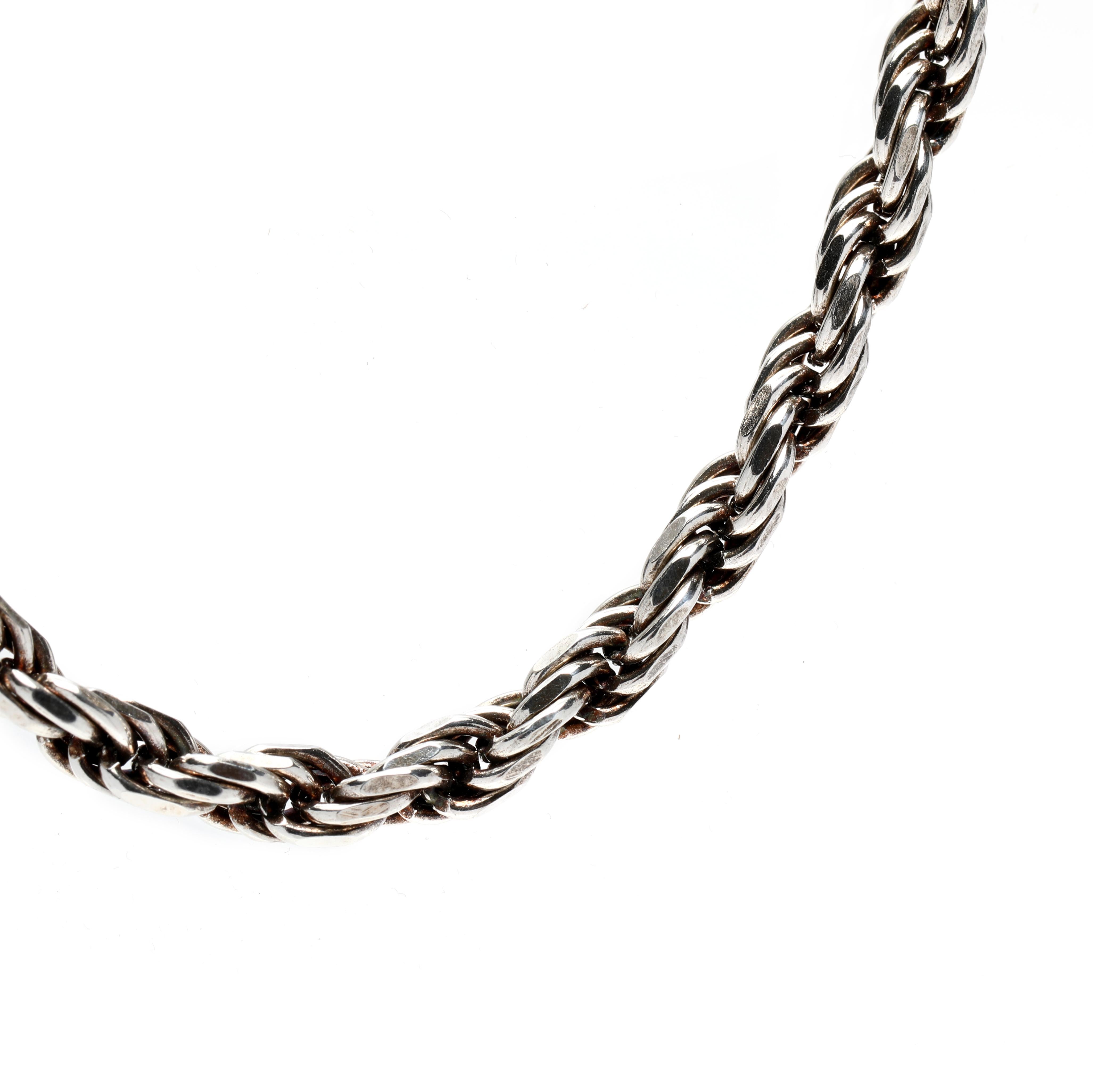 This Italian-made vintage sterling silver rope chain necklace is the perfect accessory for your outfit. The thick, wide rope chain measures 18 inches in length and is blackened silver for a unique look. Crafted from genuine sterling silver, this