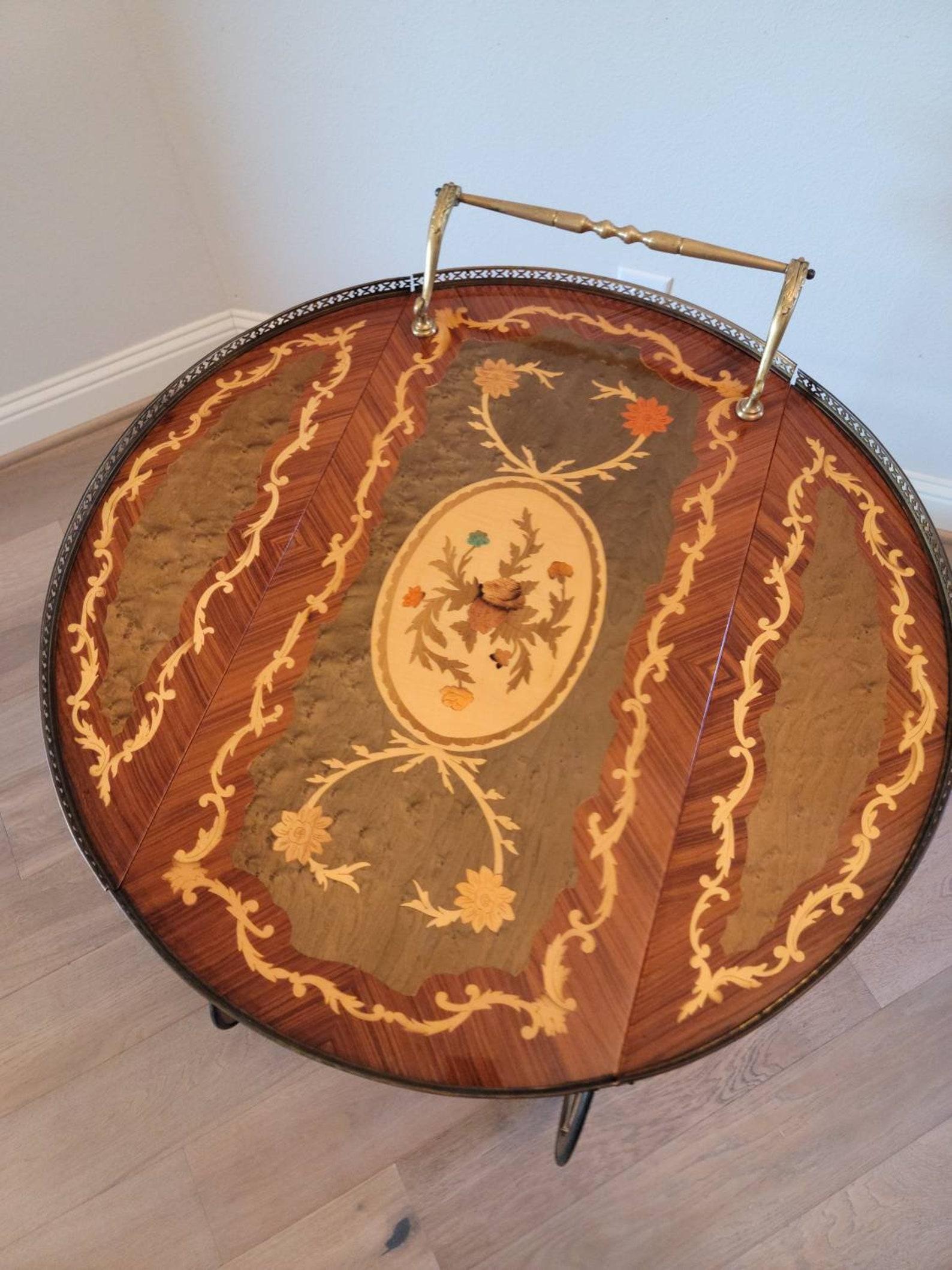 A stunning, very fine quality Italian floral marquetry drop-leaf bar service cart.

Born in Italy in the mid-20th century, featuring the most exquisite exotic woods marquetry-work, burled olive Birdseye reserves, scroll banding, and matched