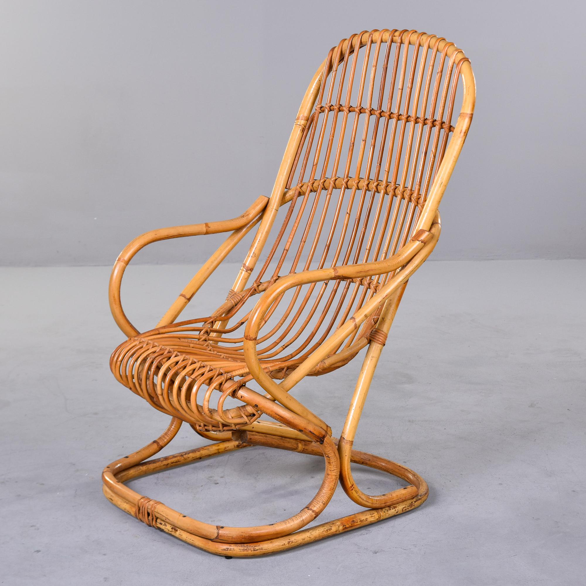 Found in Italy, this rattan armchair was designed by Tito Agnoli in 1950. Curvy and comfortable, this single chair can be used with or without a cushion. At the time of this posting, we have another pair of this same style/maker available. If