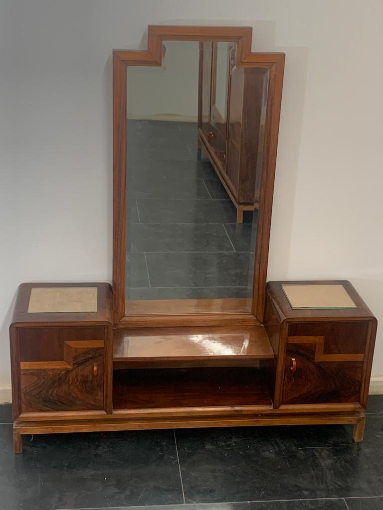 Toilet with mirror in rationalist style in walnut, walnut root and maple. Splendid rationalist-style handles in chrome metal and pastel orange bakelite. On the top there is a compartment for storing fabric with glass above. The lines echo the
