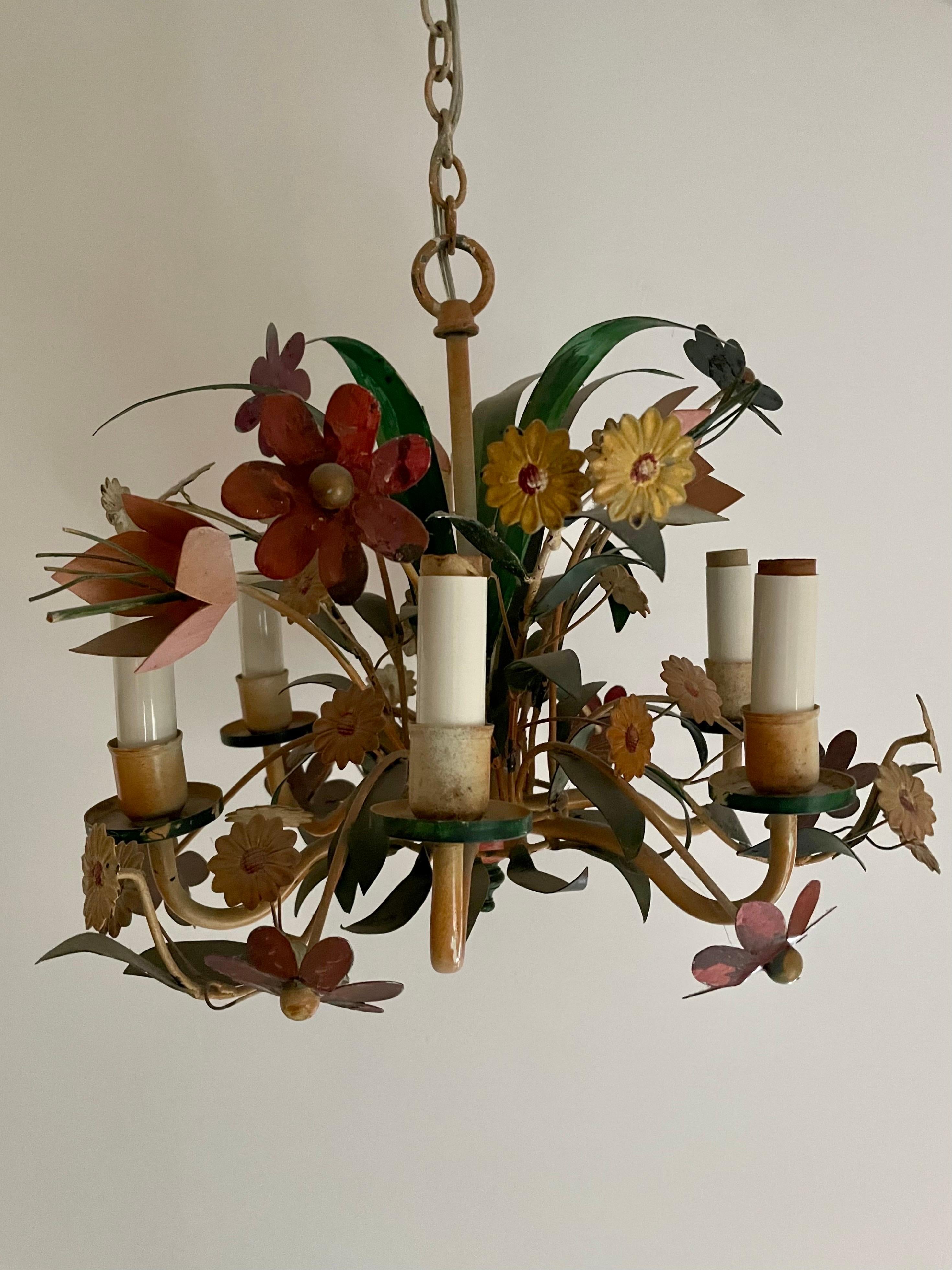 Hollywood Regency tole floral bouquet chandelier. Like a bouquet with many types of multi color flowers and leaves. Original ceiling cap. Made in Italy. Six arms. Measures 14