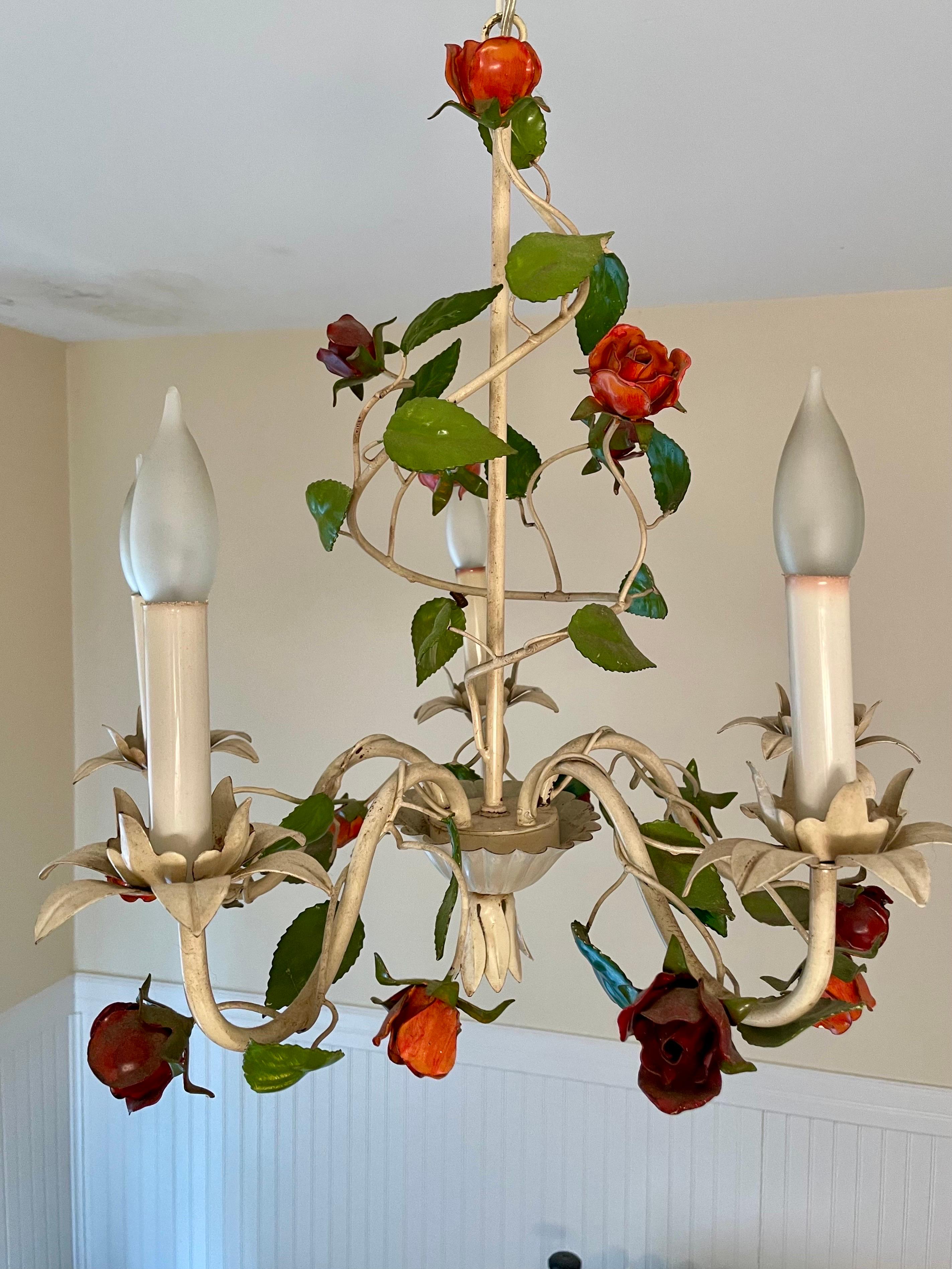 Hollywood Regency tole floral chandelier with red and orange roses and leaves. Original ceiling cap. Made in Italy. Five arms. Measures 20