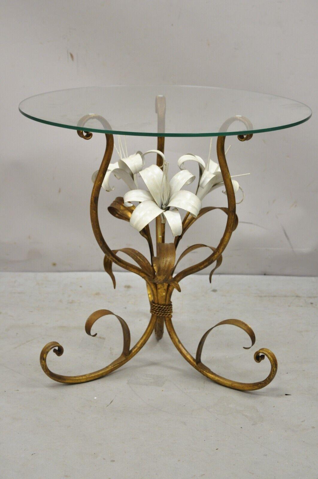 Vintage Italian tole metal gold gilt white flower round glass top side table. Item features a round clear glass top, gold gilt iron base, white flowers, very nice vintage item, great style and form. Circa mid-20th century. Measurements: 20.25