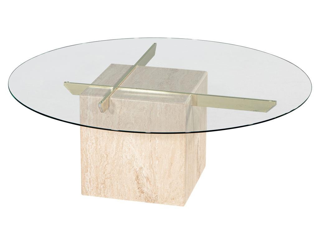 Vintage Italian travertine and glass top cocktail table with brass accents. Brand new round glass top on original 1970's Italian travertine pedestal with inlay brass bars. Price includes complimentary curb side delivery to the continental USA.