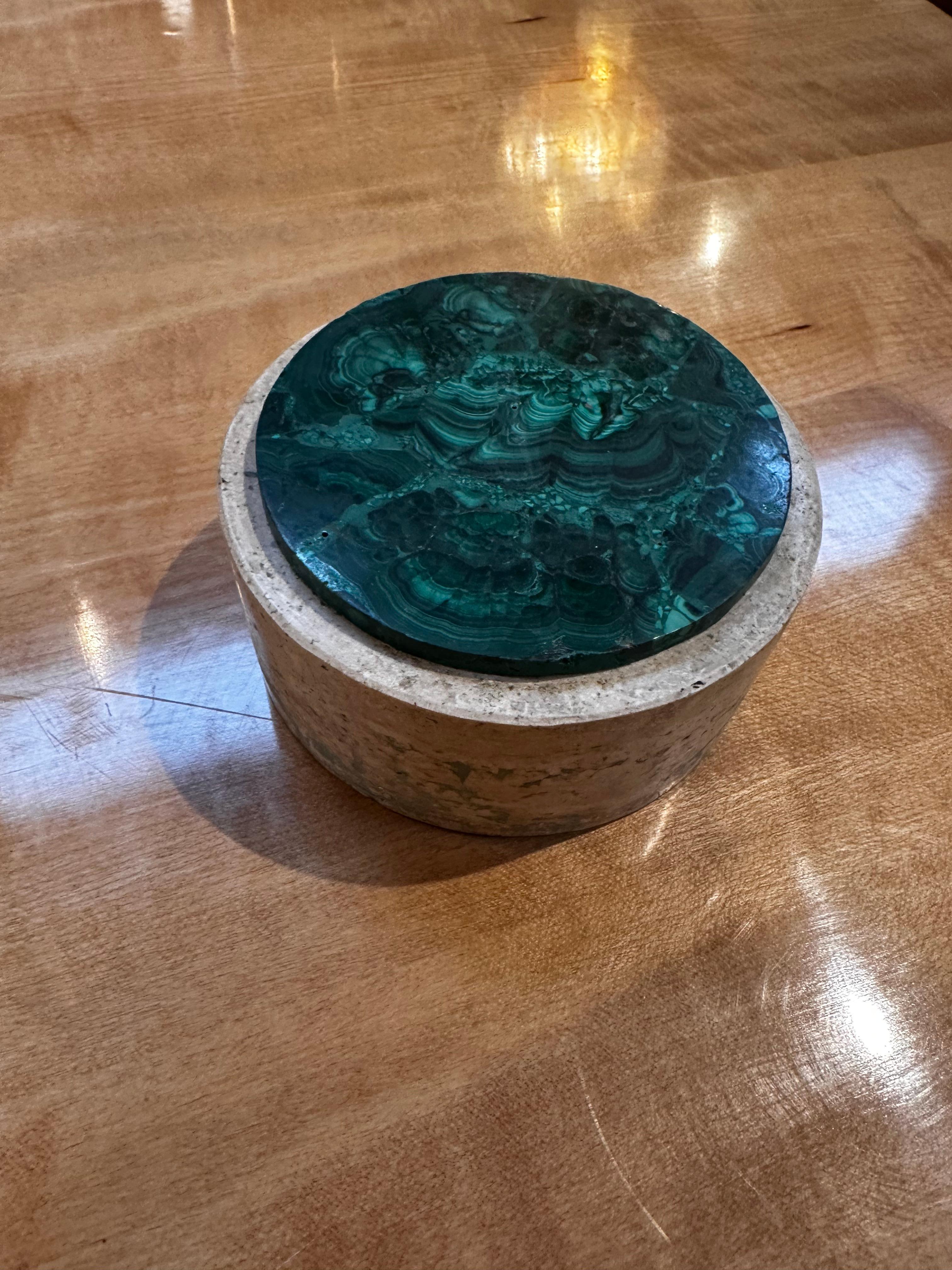 Indulge in the elegance of our Vintage Italian Travertine and Green Marble Ashtray, a captivating piece from the 1990s. Expertly crafted in Italy, this ashtray features a round base in luxurious travertine, complemented by a striking green marble