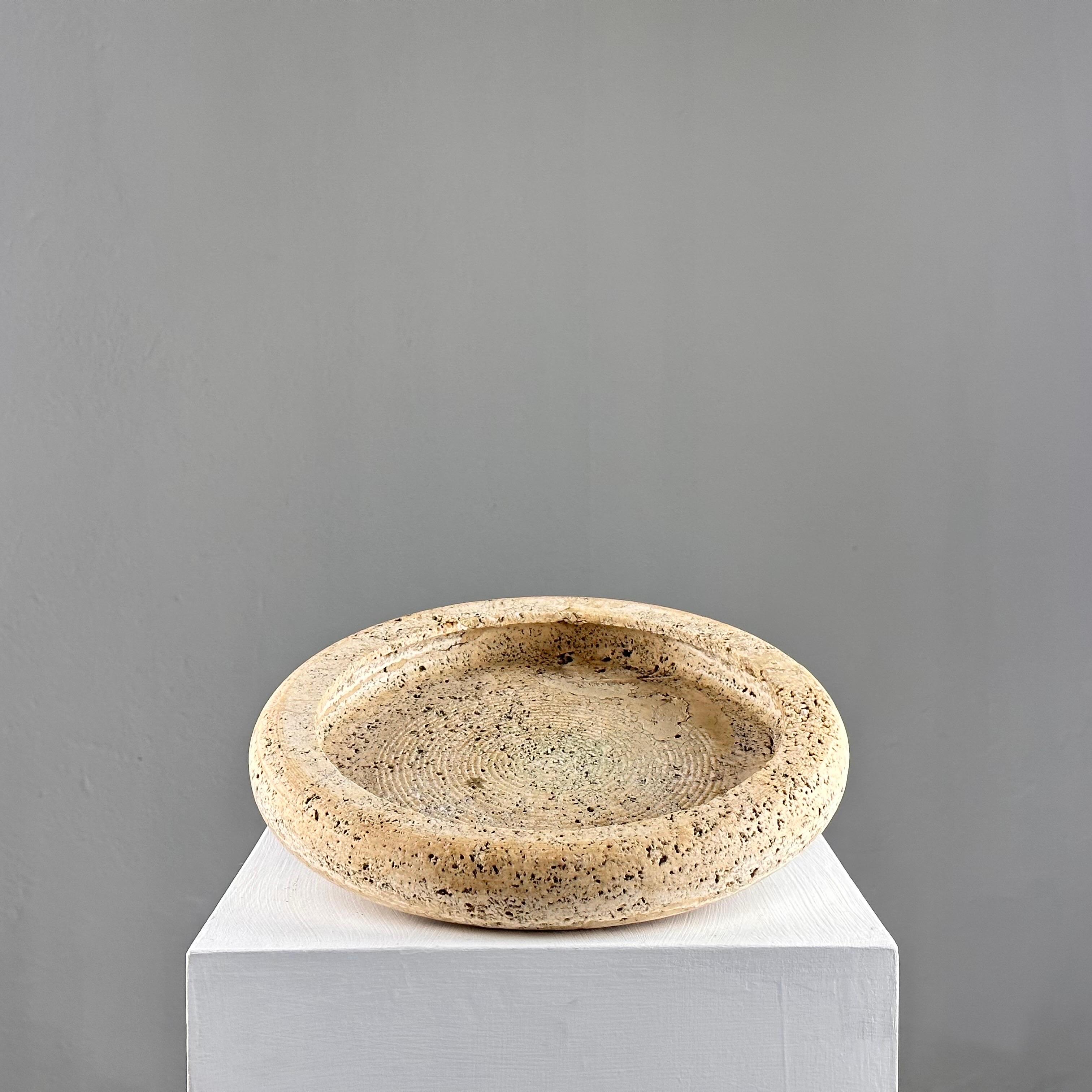 
Elevate your tabletop decor with this exquisite vintage centerpiece bowl crafted from Italian travertine, dating back to the 1970s. Measuring 28.5 cm in diameter, this stunning piece features a beautiful patina that adds depth and character to its