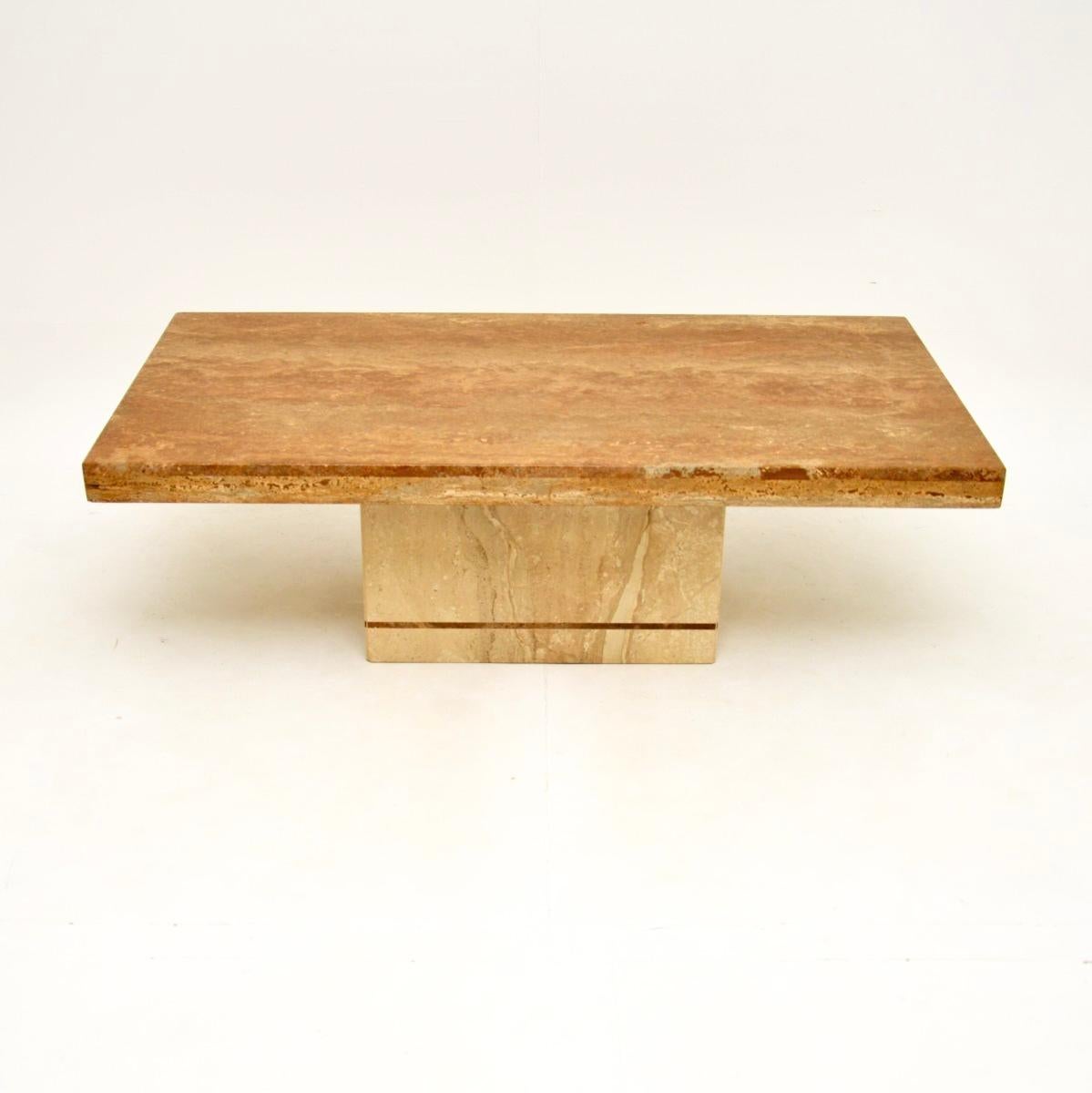 A stylish and extremely well made vintage Italian travertine coffee table, dating from the 1970’s.

This is of superb quality and has a gorgeous design. The rectangular top overhangs a pedestal base, it is all made from solid travertine. The