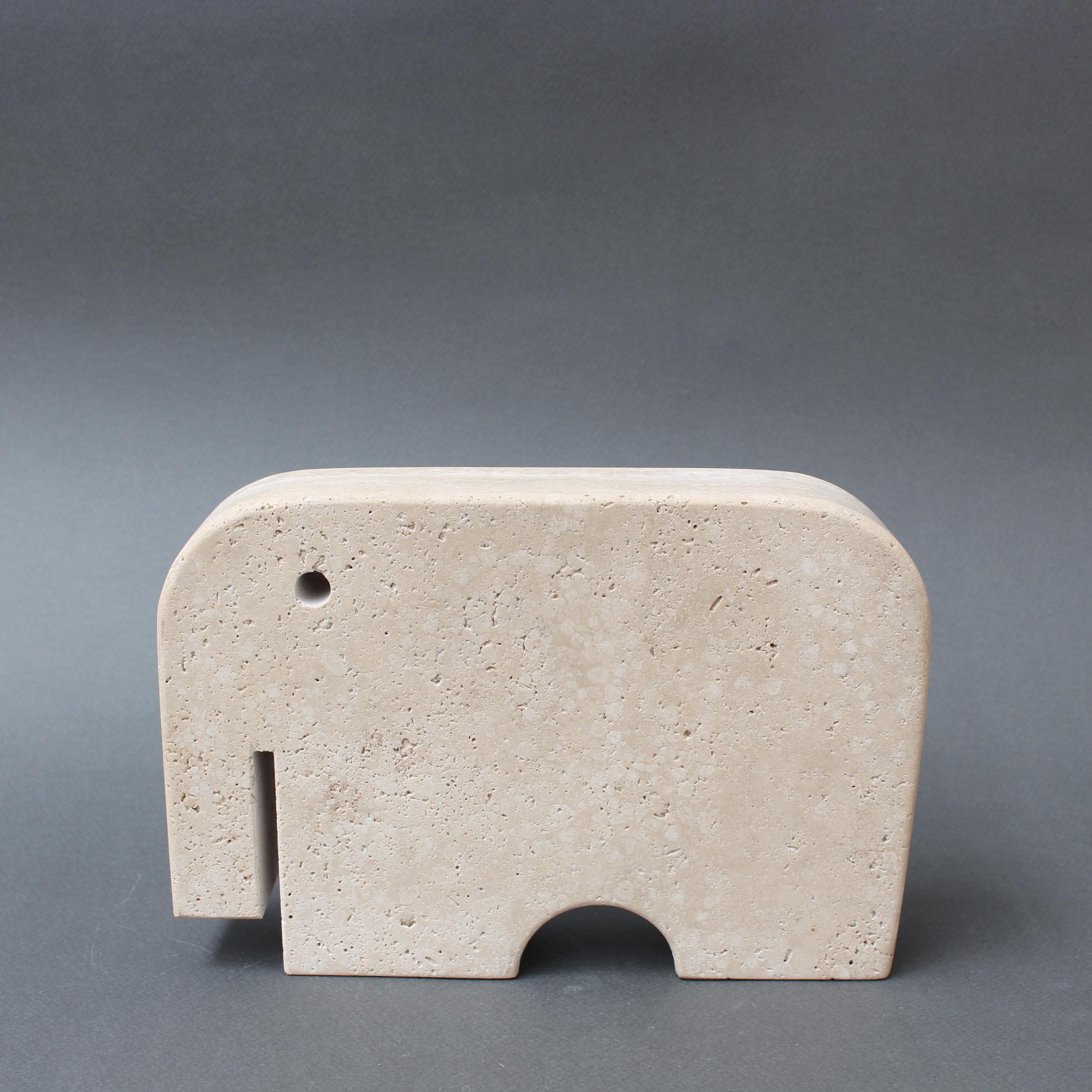 Travertine elephant table sculpture by Mannelli Bros., Florence, Italy (circa 1970s). Joyful travertine stylised elephant will delight art lovers and collectors. Minimalist in style with soft curves and lines. Very weighty (3.4 kg / 7.5 lbs) and