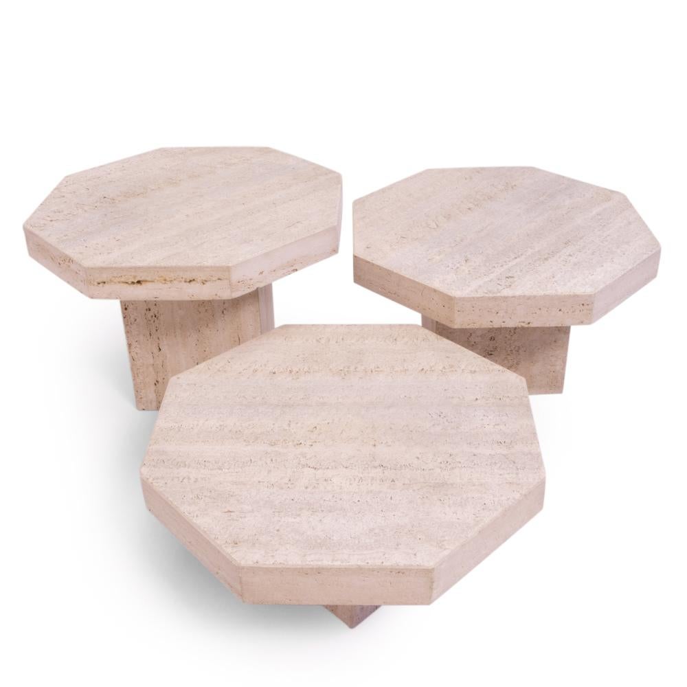 Vintage Italian travertine nesting tables from the 1970s.

This set of three octagonal coffee tables are unpolished and not filled, giving the surface an extra dimension due to the small crevasses.

The table tops are all the same size, only at