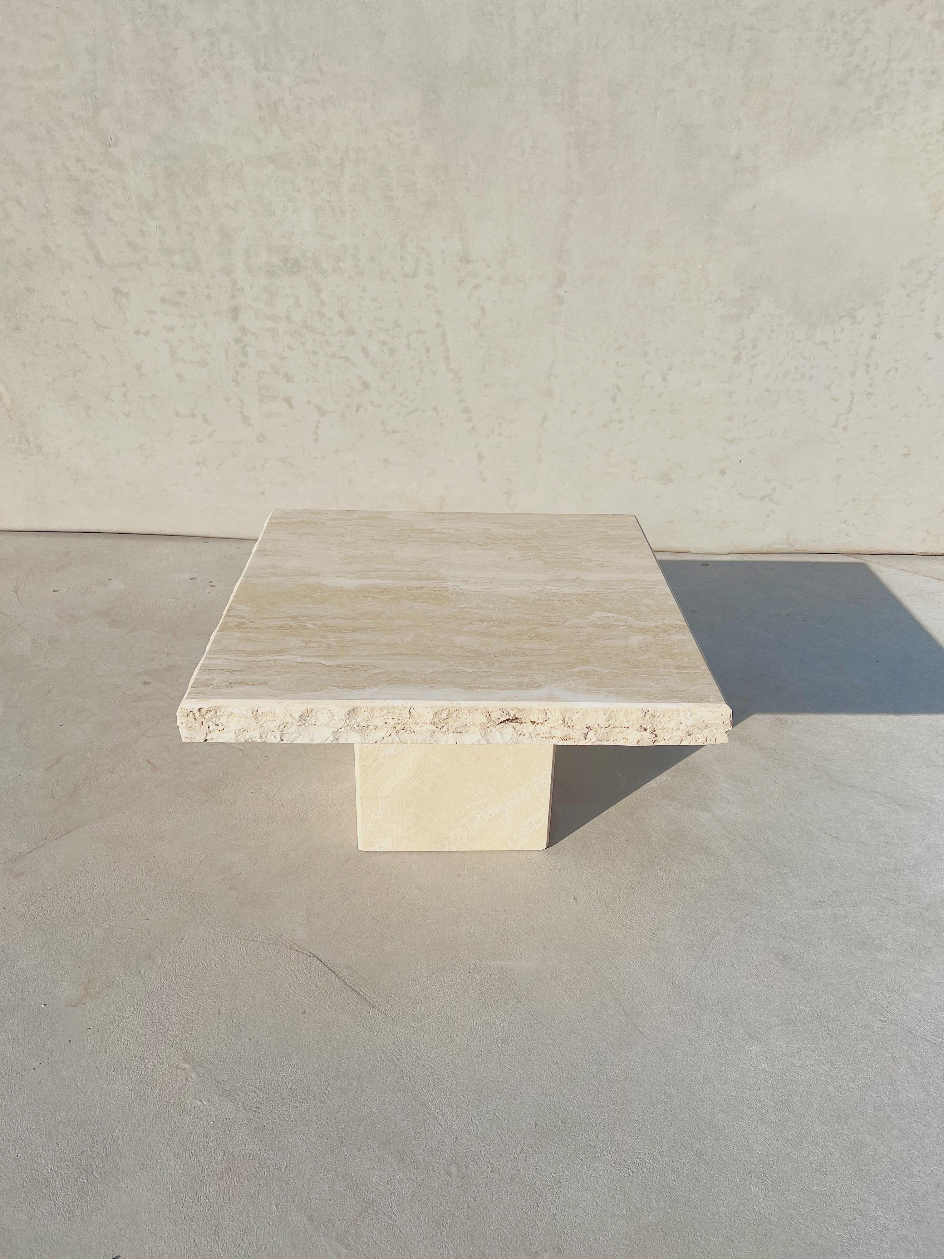 Vintage Italian Travertine square coffee table with live edges

A vintage Italian travertine coffee table, showcasing a polished base and a smooth, freshly polished and newly sealed top accented with textured live edges 

Milky, wavy, textured