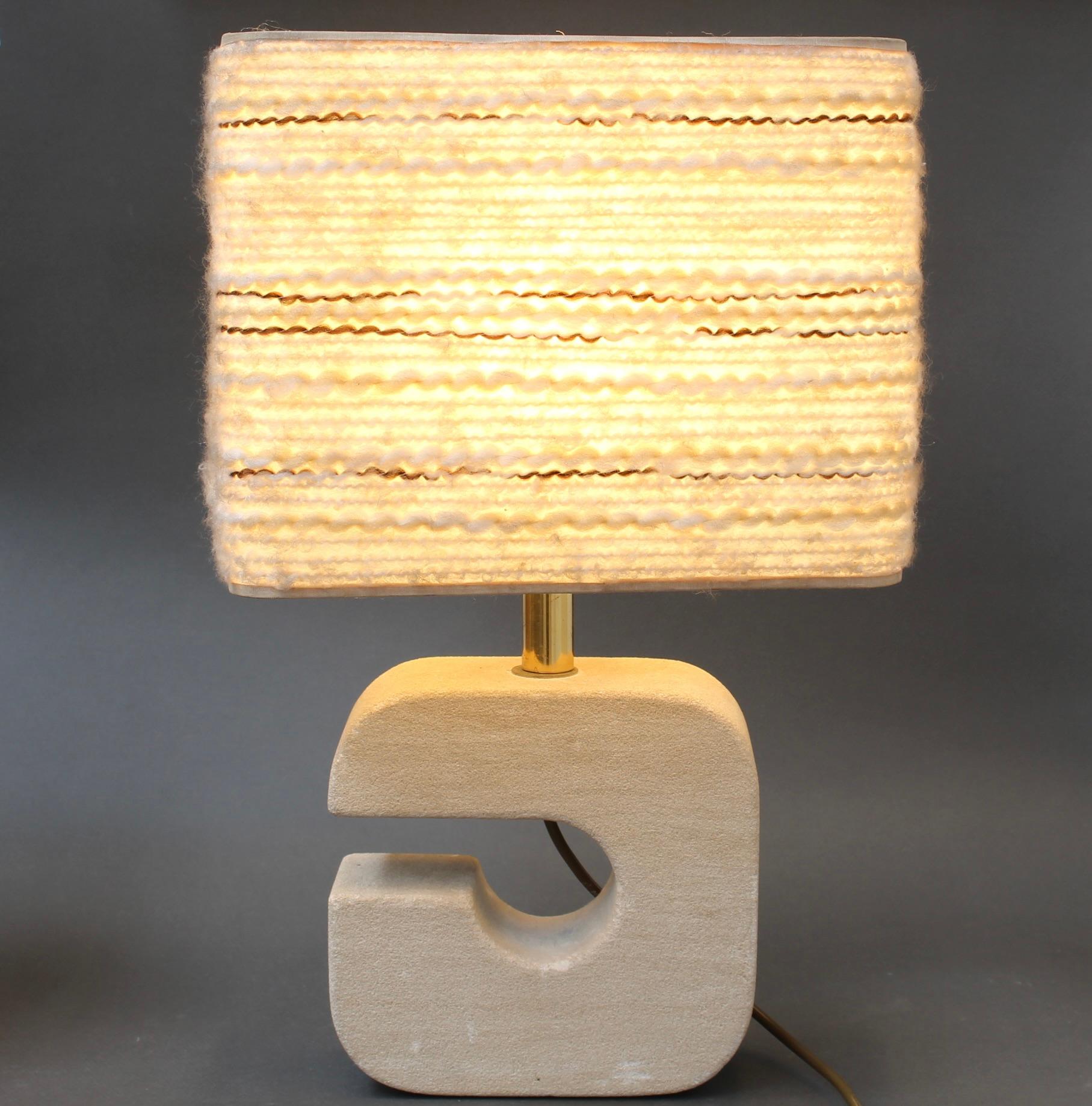 Vintage Italian travertine table lamp (circa 1970s). Travertine is a natural sedimentary rock that is most often found in Italy and used in architecture and indoor decoration. The stone has a timeless appeal and beauty with which few materials can