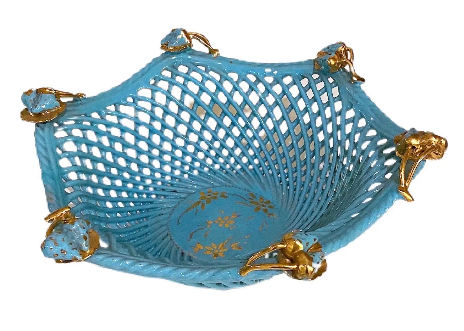 This stunning open basket weave bowl is the prettiest shade of blue with gold accents. The bottom center of the bowl has gold delicate flowers painted. The top of the bowl is adorned with 6 gold and turquoise strawberries. It is marked “Italy Paul