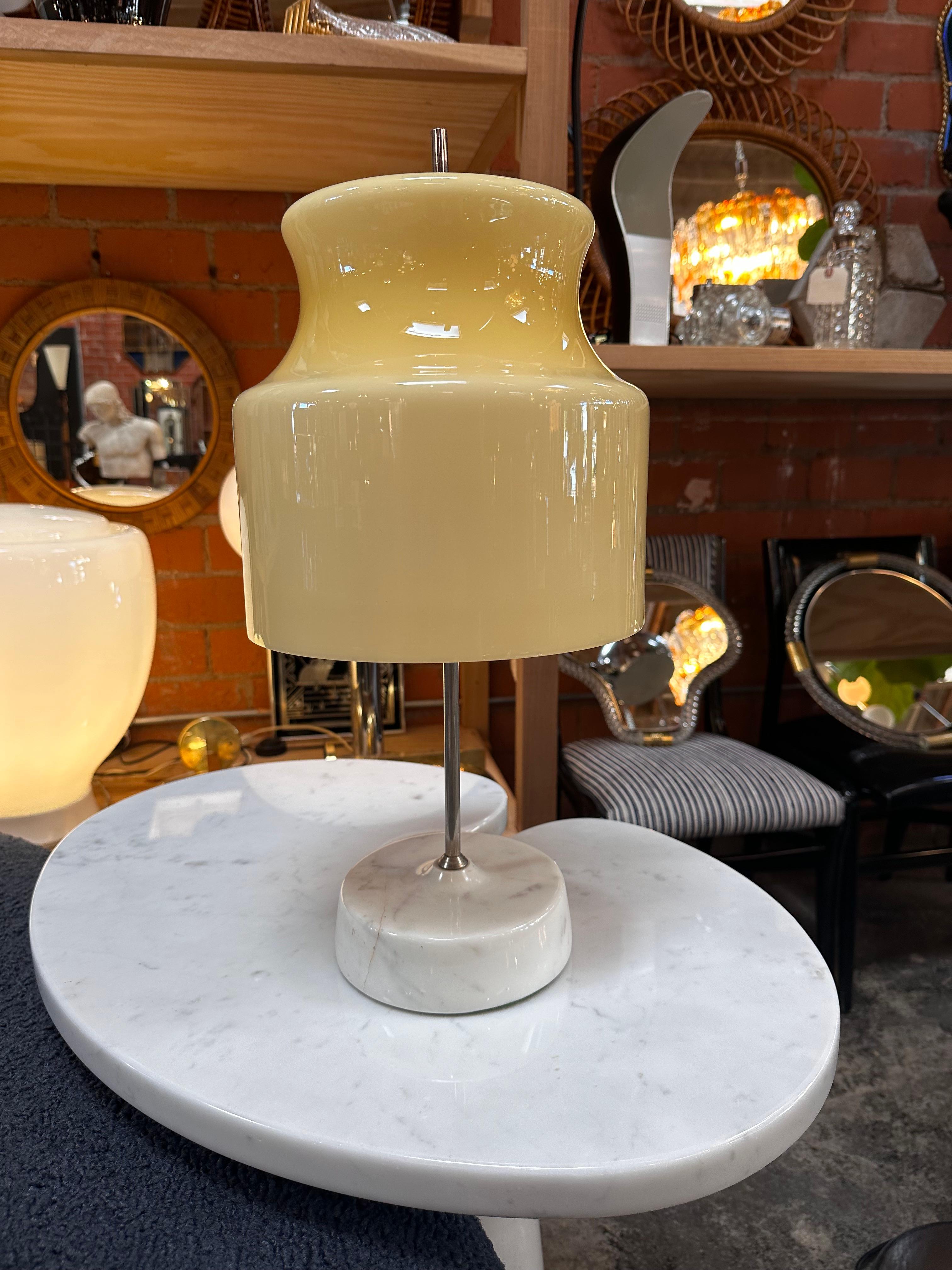 Illuminate your space with sophistication using our Vintage Italian Unique Marble and Glass Table Lamp from the 1980s. Featuring a round marble base, a delicate glass shade, and a sleek chrome stand, this lamp seamlessly blends elegance and modern