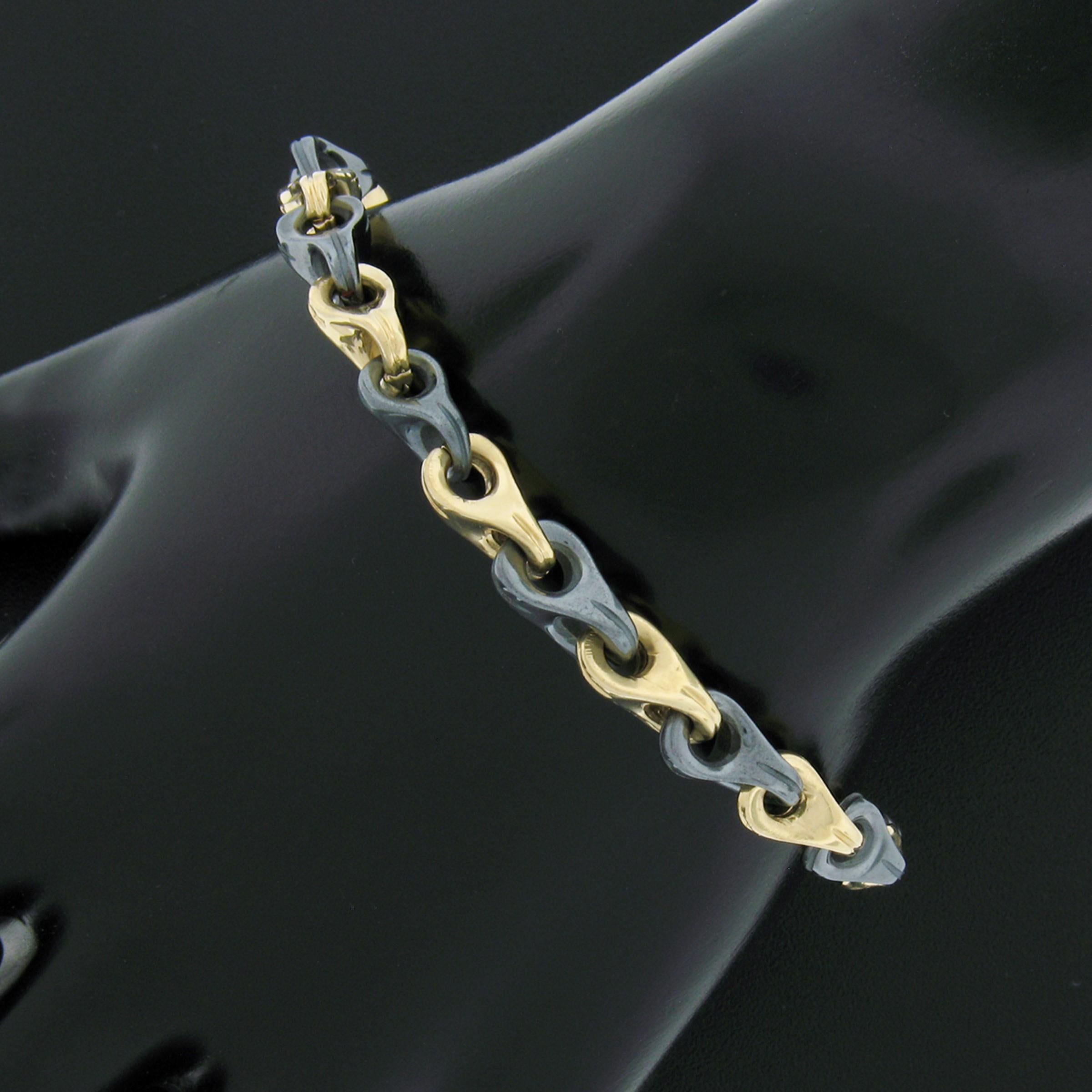 This beautiful vintage bracelet was well crafted in Italy from solid 14k yellow gold and is nicely structured with alternating links throughout. The links feature gorgeous hematite stones displaying a fine metallic gray color throughout their