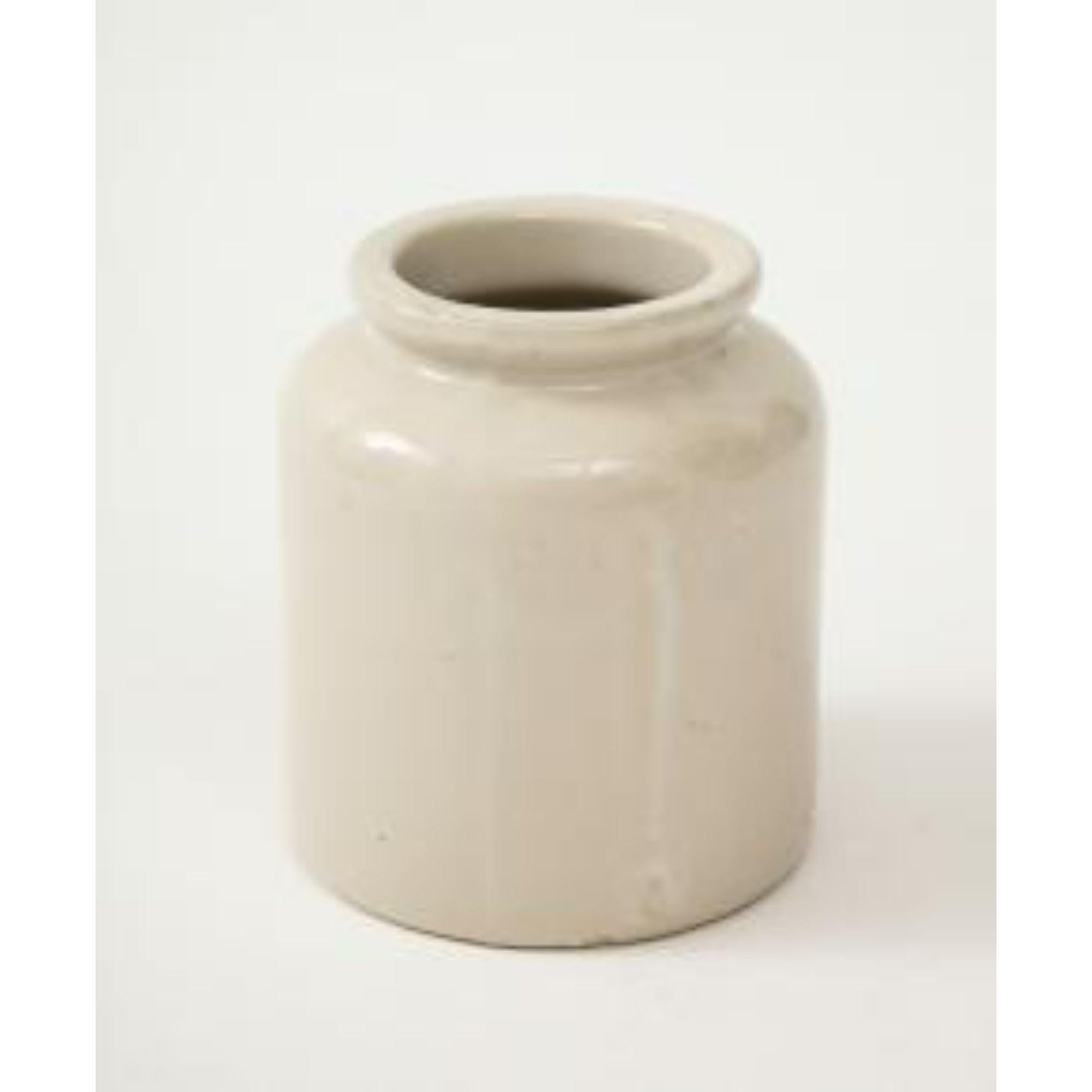 Hand-painted in a cream tone with a light glaze that gives off a soft, understated sheen.

