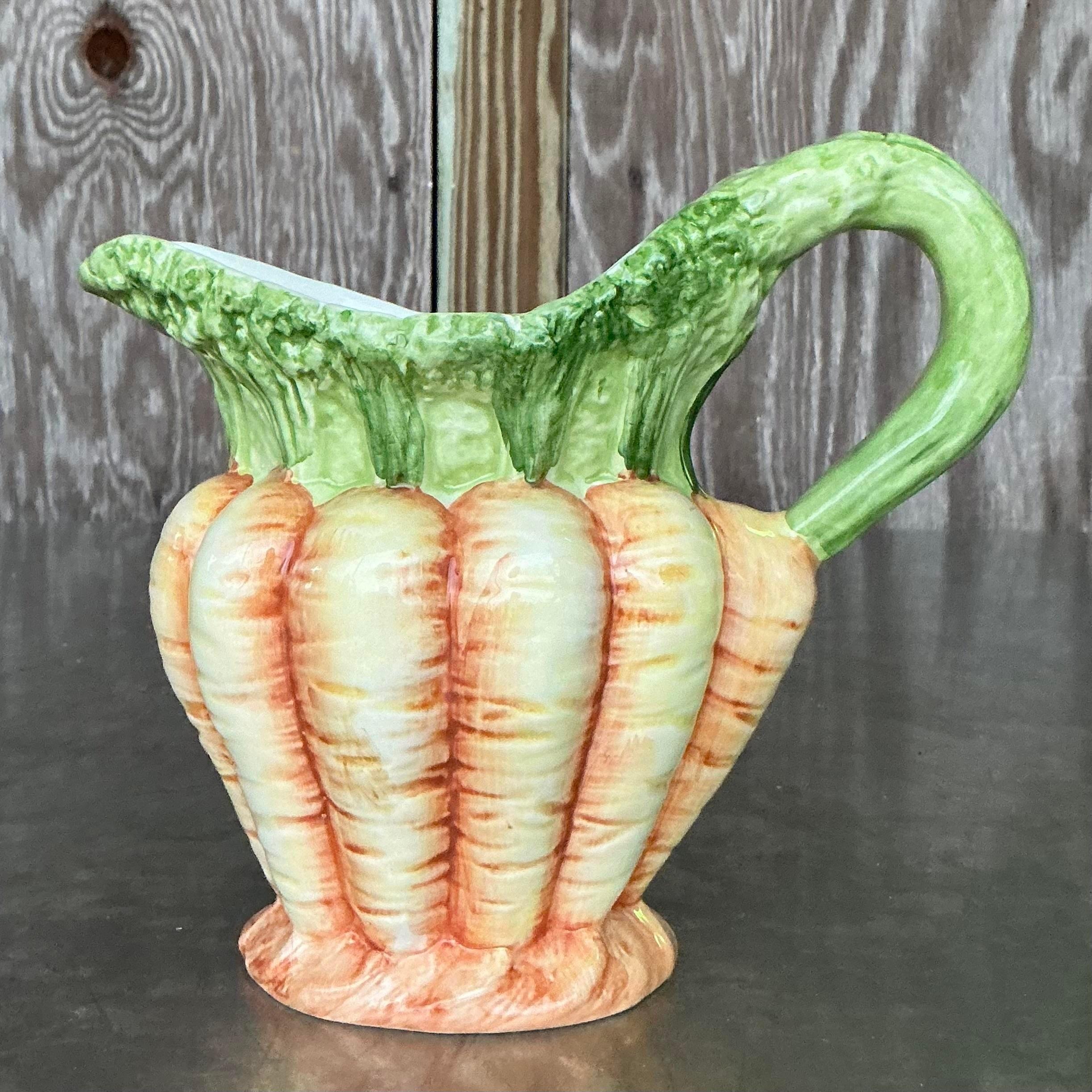 Brighten up your kitchen with this Vintage Italian Vietri Glazed Ceramic Carrots Pitcher. Featuring a charming carrot motif and vibrant glaze, this pitcher combines Italian craftsmanship with a playful design. Perfect for serving beverages or as a